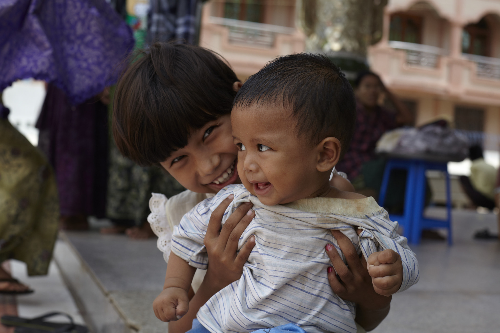 Canon EF 50mm F1.4 USM sample photo. Little girl with her little brother photography