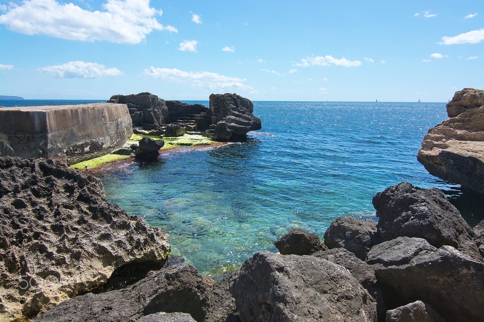 IX-Nikkor 30-60mm f/4-5.6 sample photo. Rocky landscape with green seagrass photography