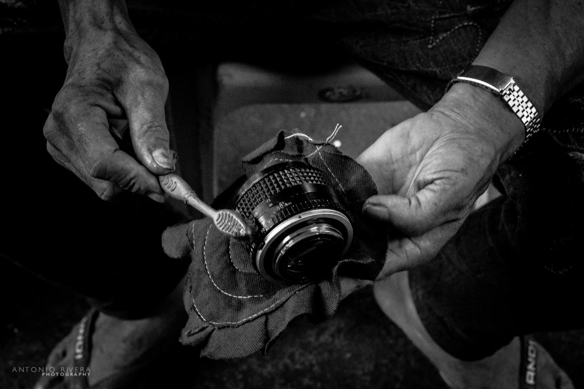 Fujifilm X-Pro1 + Fujifilm XF 56mm F1.2 R APD sample photo. Servicing a vintage lens in the street photography