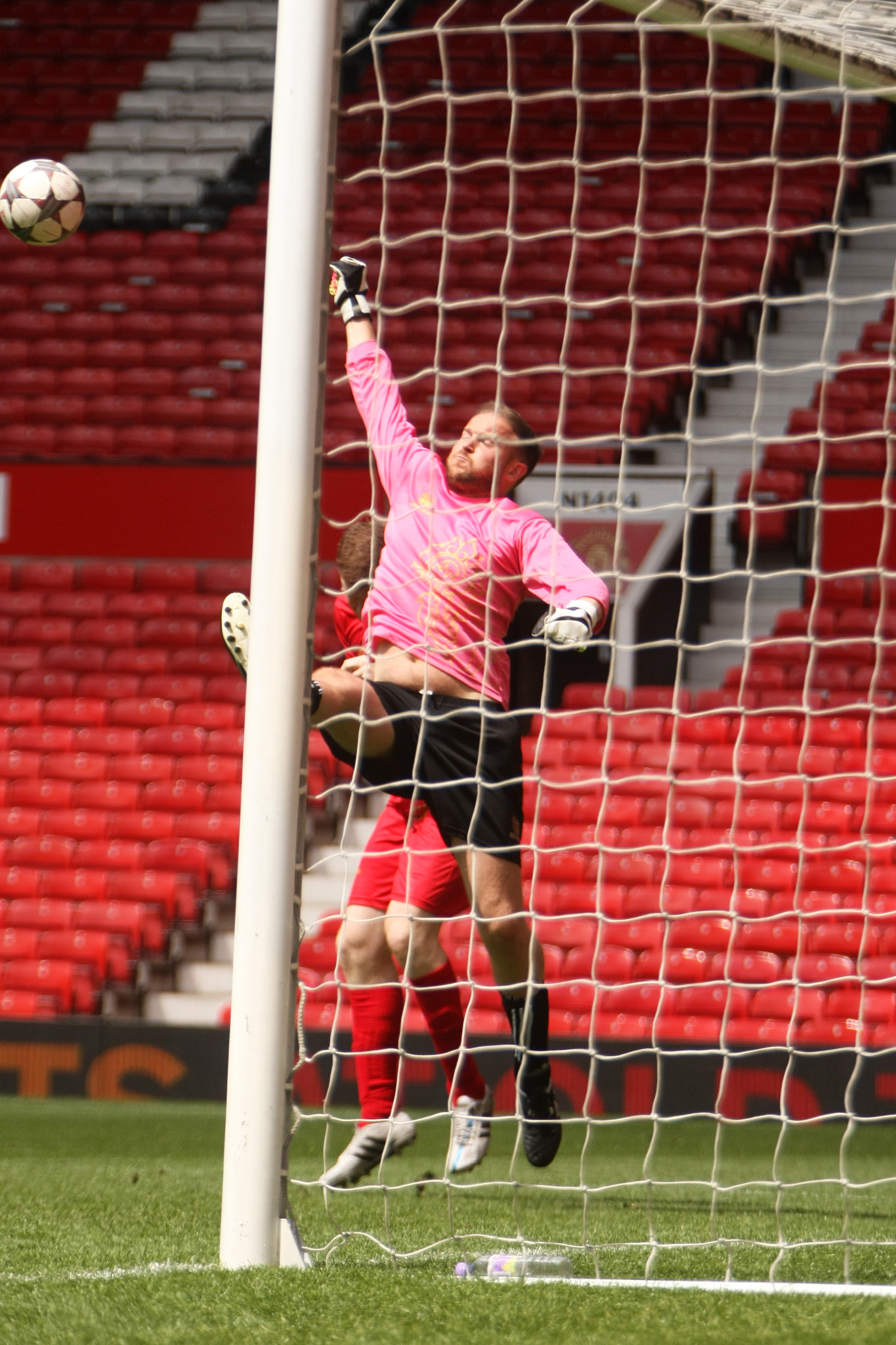 Canon EF 70-200mm F2.8L IS USM sample photo. Goalkeeper coming to punch the ball away photography