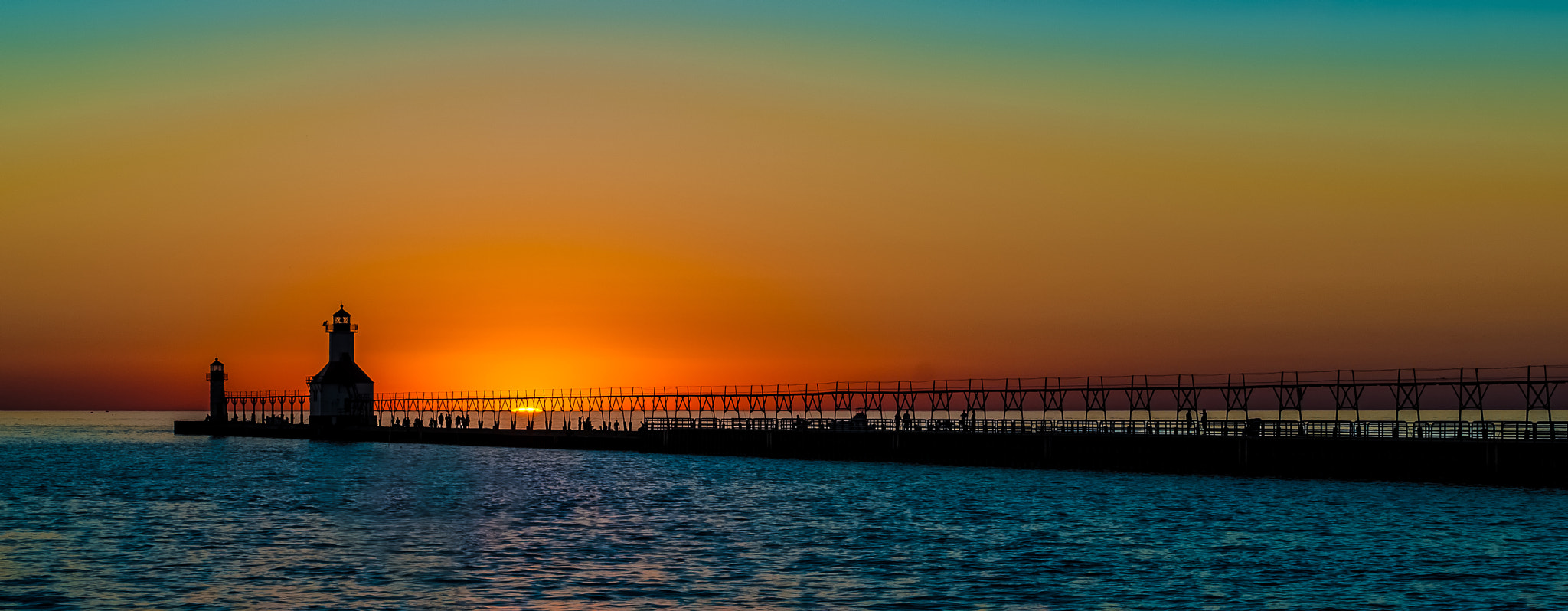 Nikon D200 + Sigma 50-150mm F2.8 EX APO DC HSM sample photo. Lighthouse on lake michigan at sunset photography