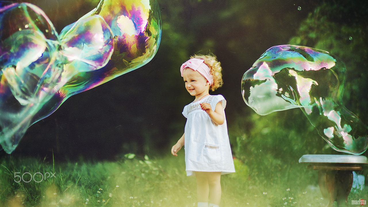 Nikon D7000 + Sigma 85mm F1.4 EX DG HSM sample photo. Girl with soap bubbles photography