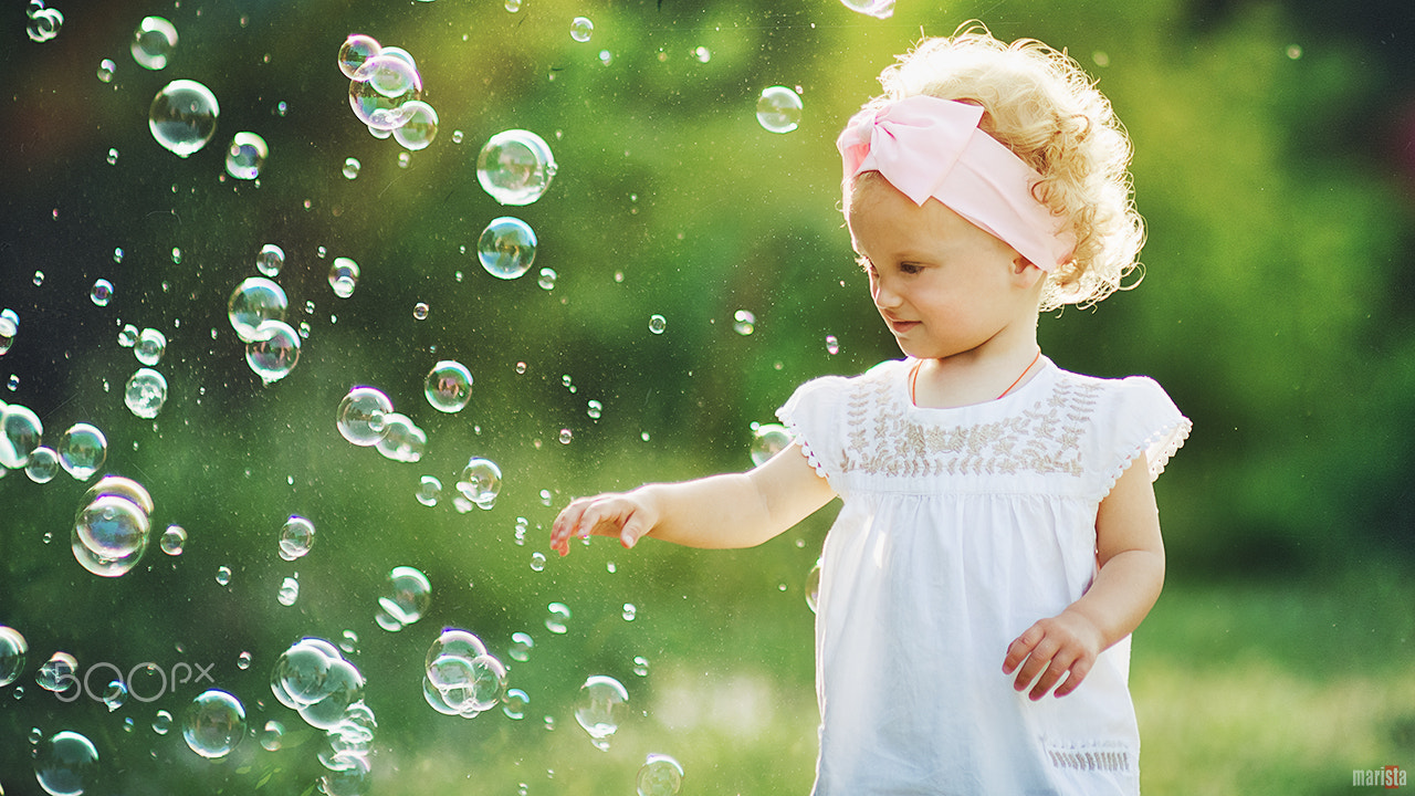 Nikon D7000 + Sigma 85mm F1.4 EX DG HSM sample photo. Girl with soap bubbles photography