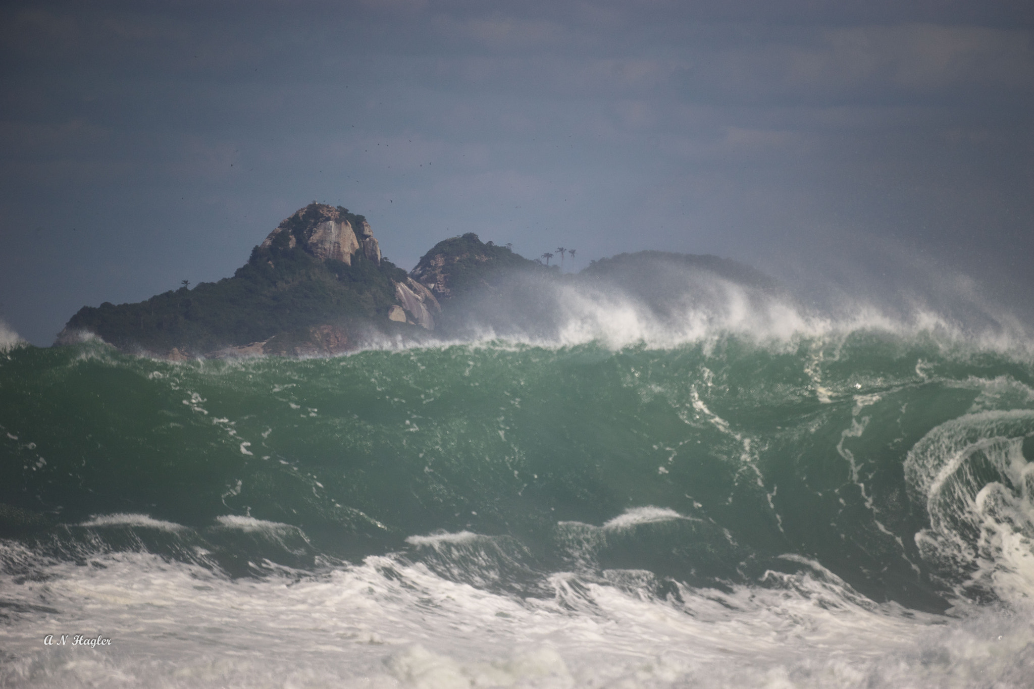 Sony a7 + Sony 500mm F8 Reflex sample photo. Storm surf & tropical island in sun photography