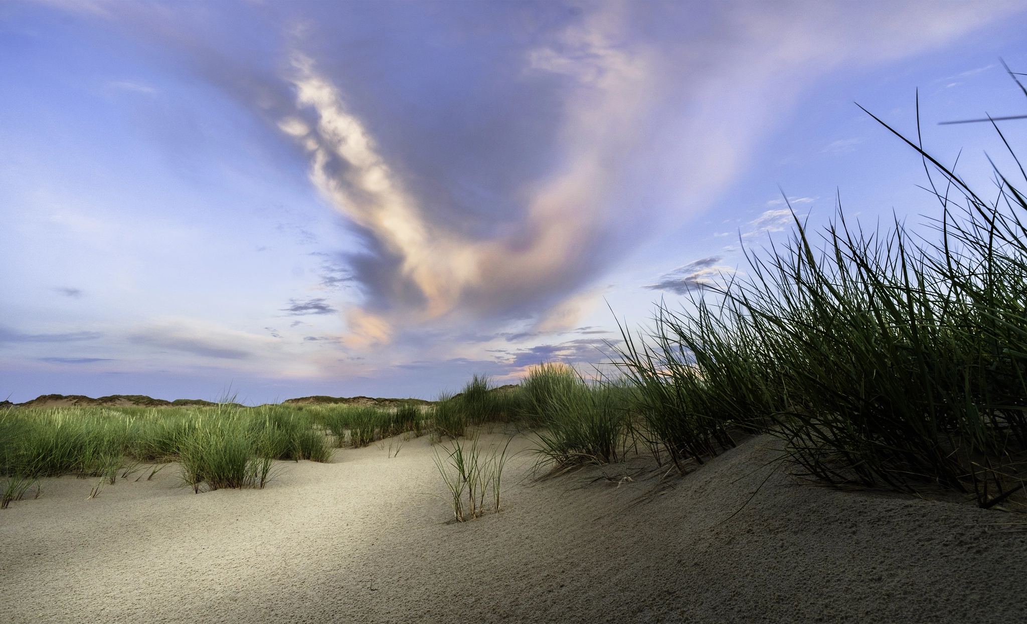 Fujifilm X-T10 + ZEISS Touit 12mm F2.8 sample photo. Color filled clouds on island end photography