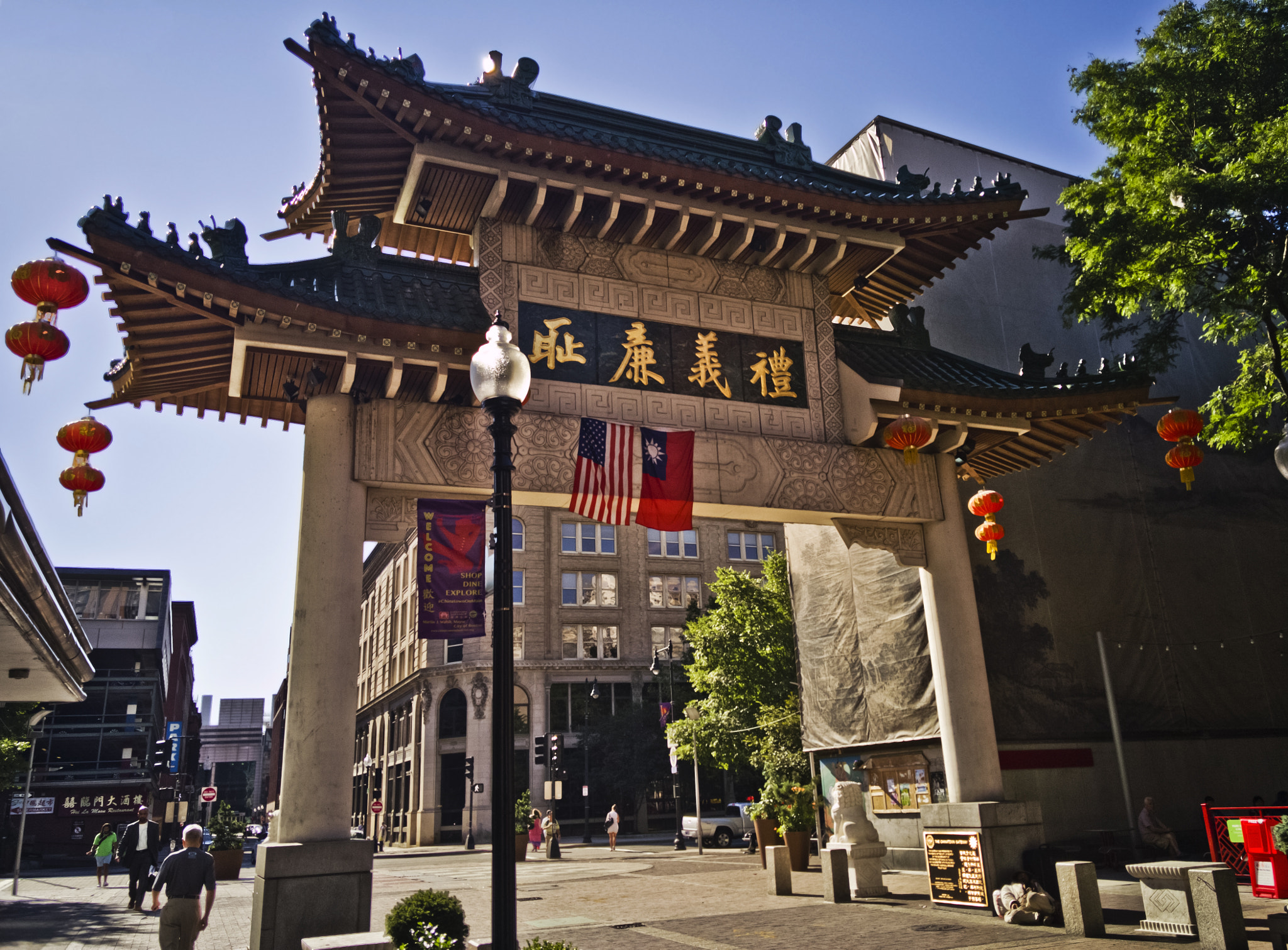 OnePlus ONE A2005 sample photo. Homeless man asleep under gates of chinatown photography