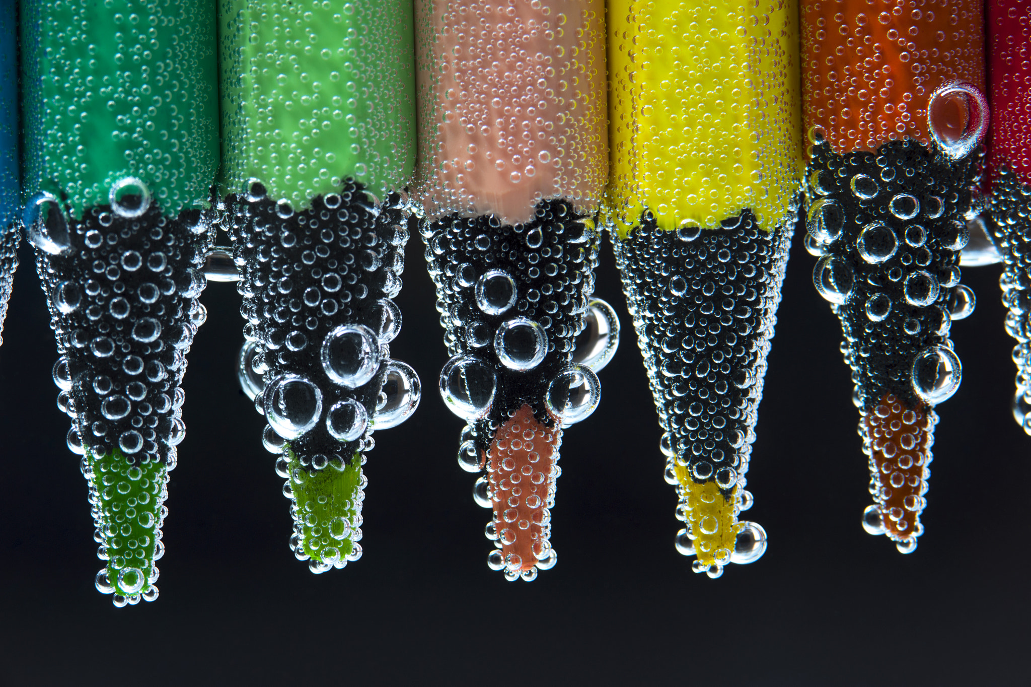Nikon D700 + AF Micro-Nikkor 105mm f/2.8 sample photo. Pencils in water with bubbles, closeup photography