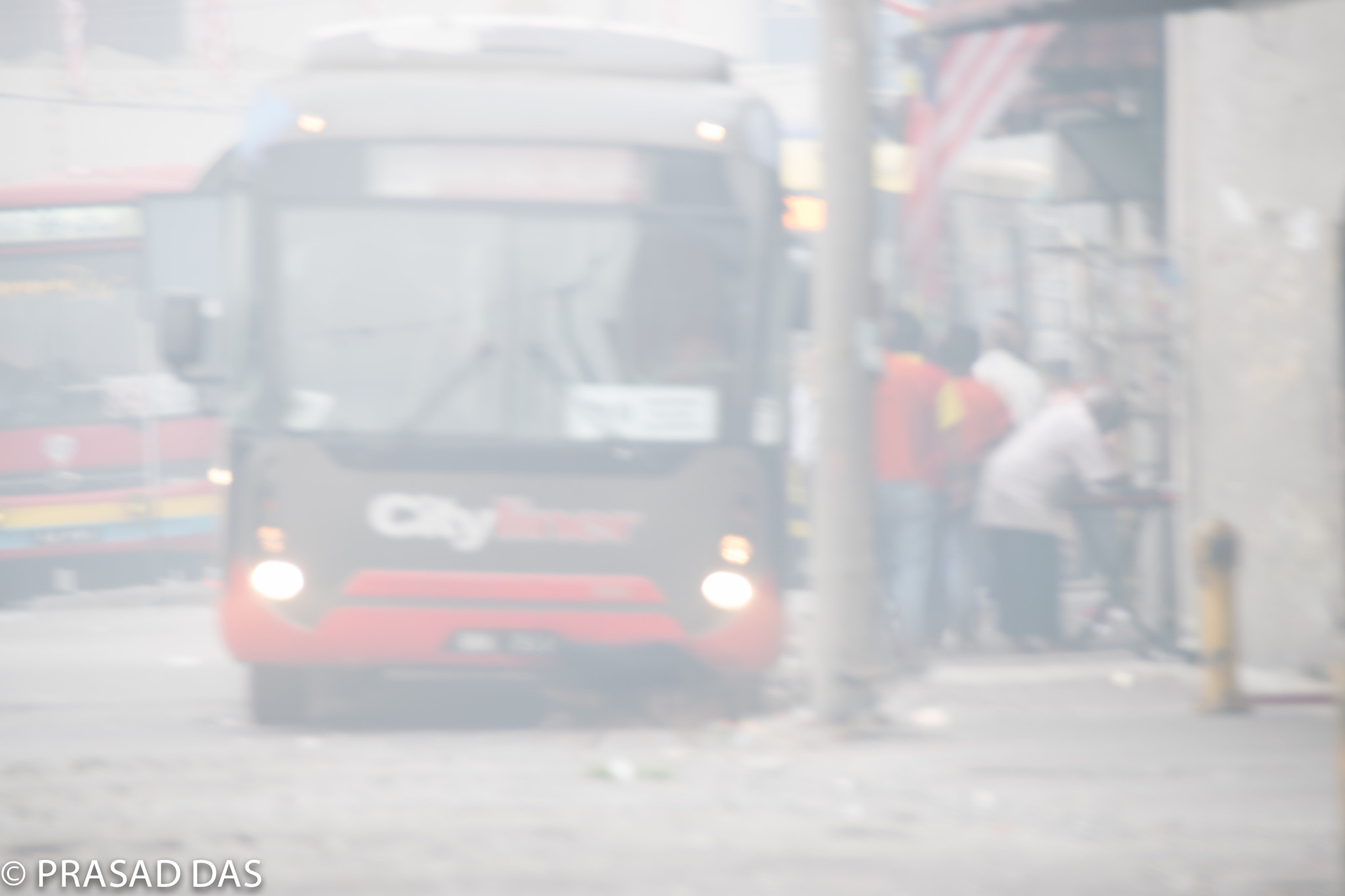 Nikon D5300 + Nikon AF-S DX Nikkor 18-300mm F3.5-5.6G ED VR sample photo. Bus depot during  heavy haze photography