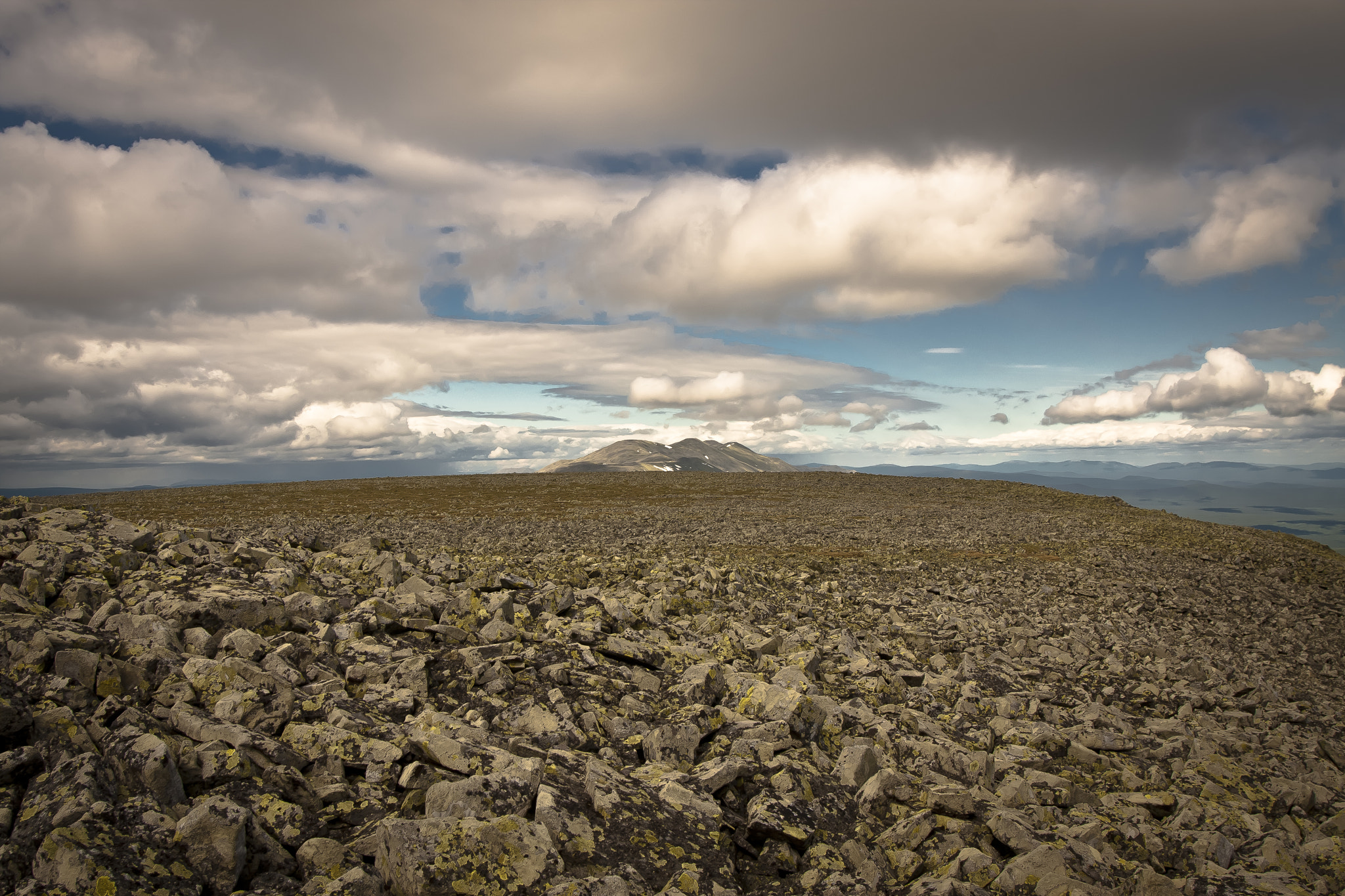 Canon EOS 40D sample photo. Clouds over stones photography