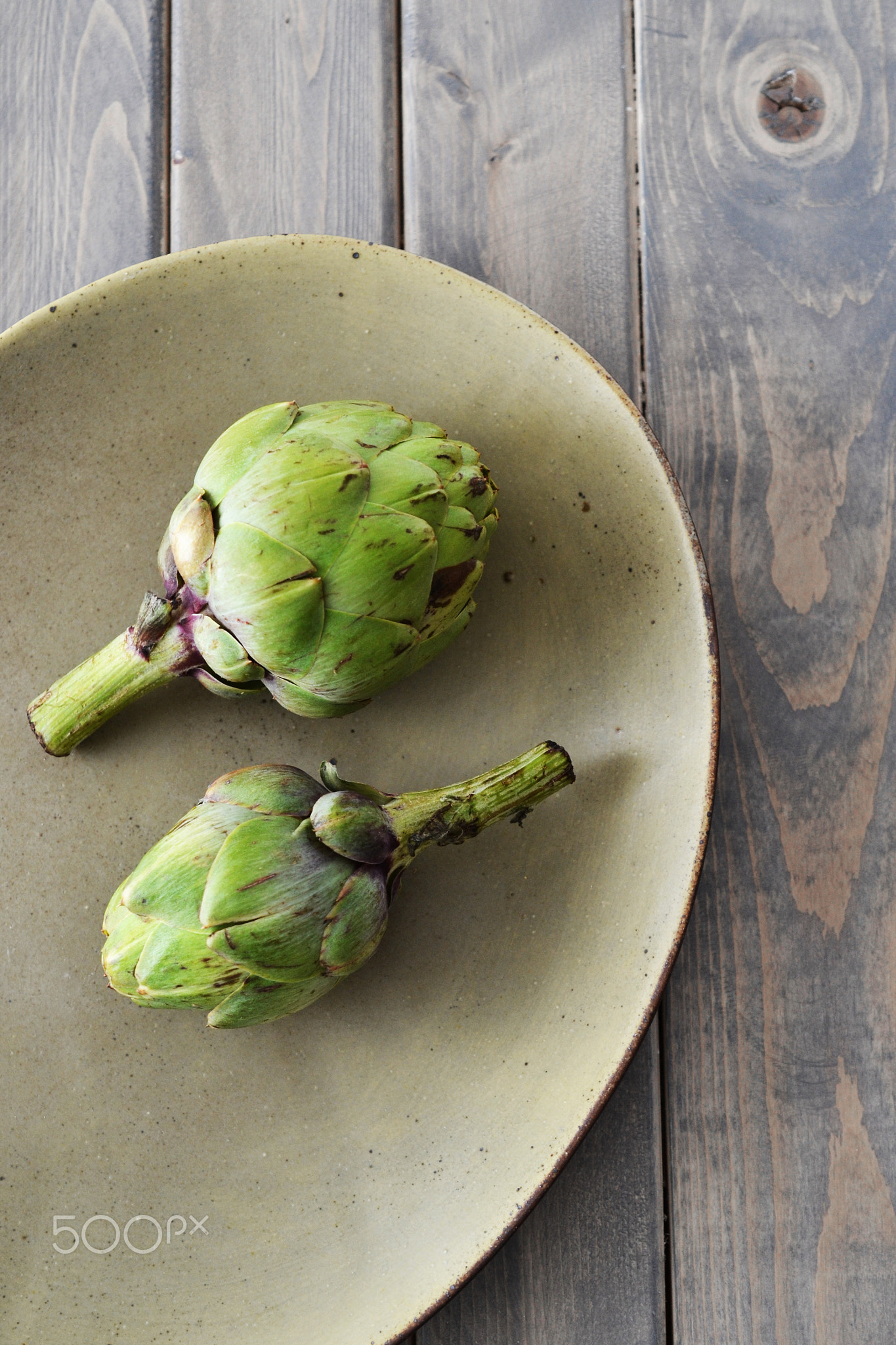 Artichokes on stoneware plate