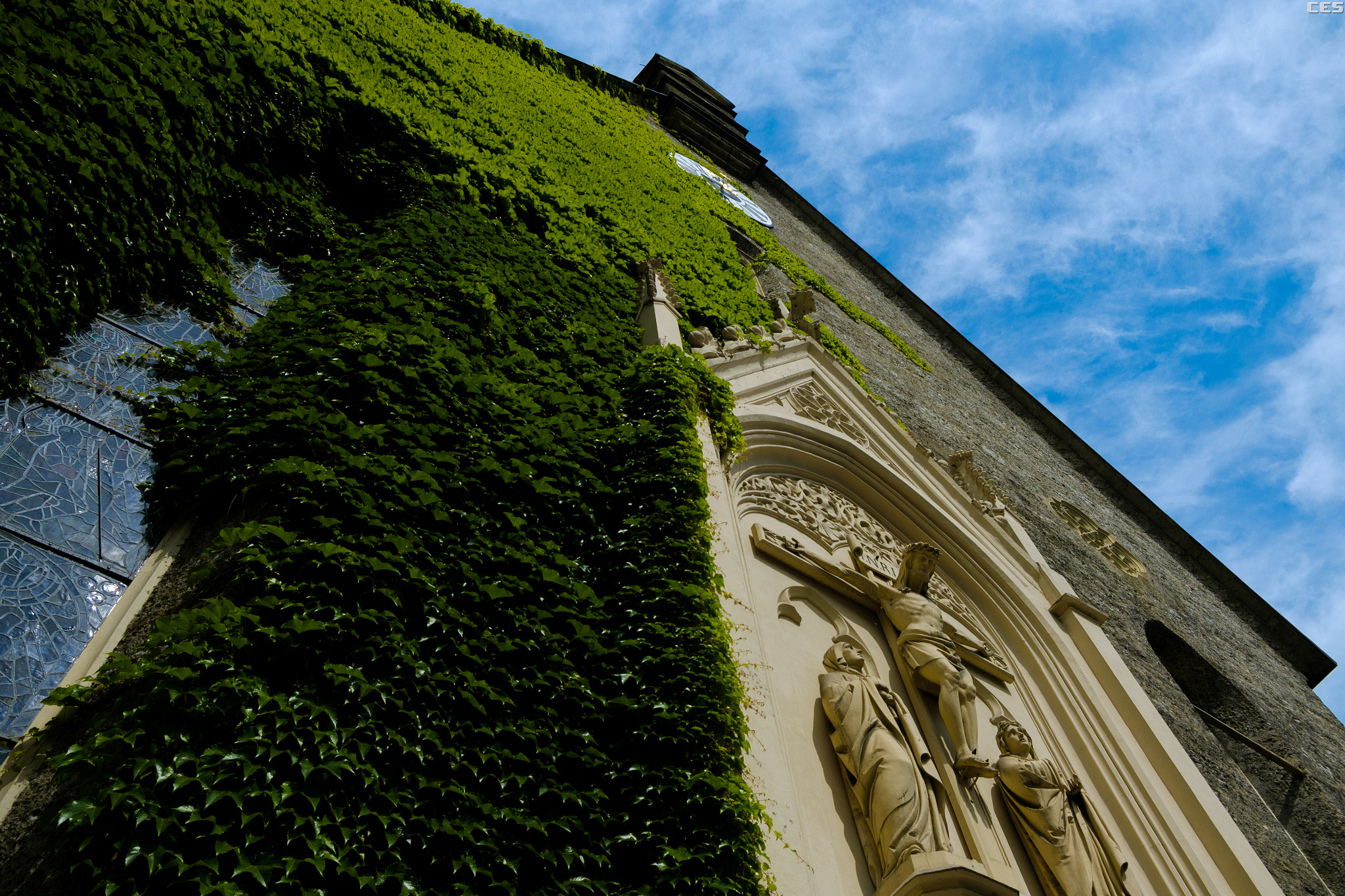 Fujifilm X-A2 + Fujifilm XF 18-55mm F2.8-4 R LM OIS sample photo. Church vine and sky photography