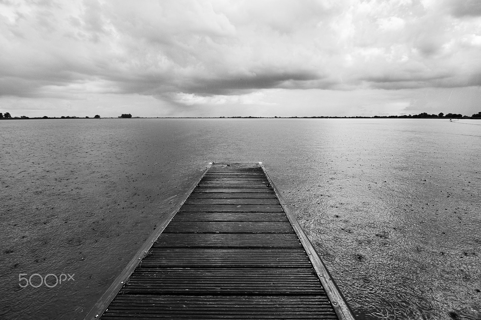 Canon EF-S 10-18mm F4.5–5.6 IS STM sample photo. Raining in black and white photography