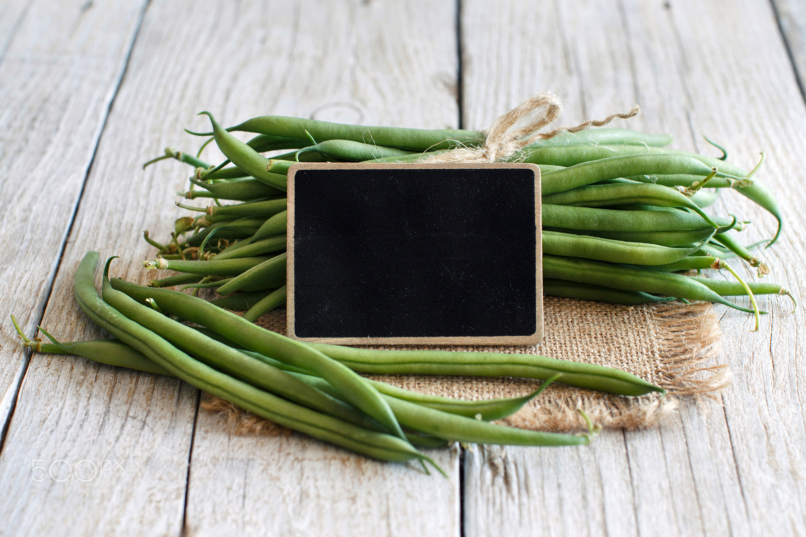 Canon EOS 650D (EOS Rebel T4i / EOS Kiss X6i) + Canon EF 50mm F1.2L USM sample photo. Green french beans  with a small chalkboard photography