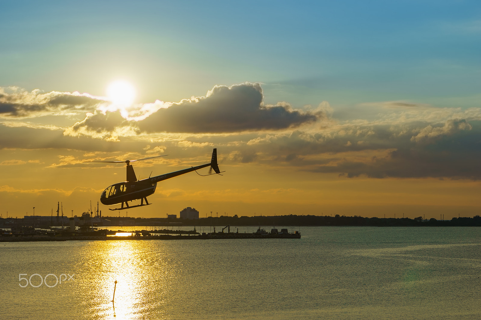 Sony a6000 + Sony FE 28-70mm F3.5-5.6 OSS sample photo. Helicopter and sunset photography