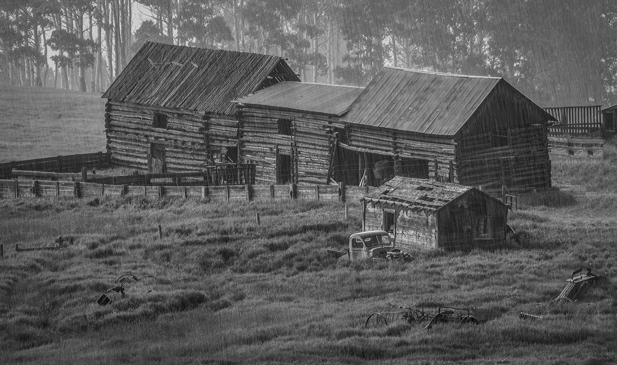Panasonic Lumix DMC-GH3 sample photo. Rain hail on the old piney creek homestead bw photography