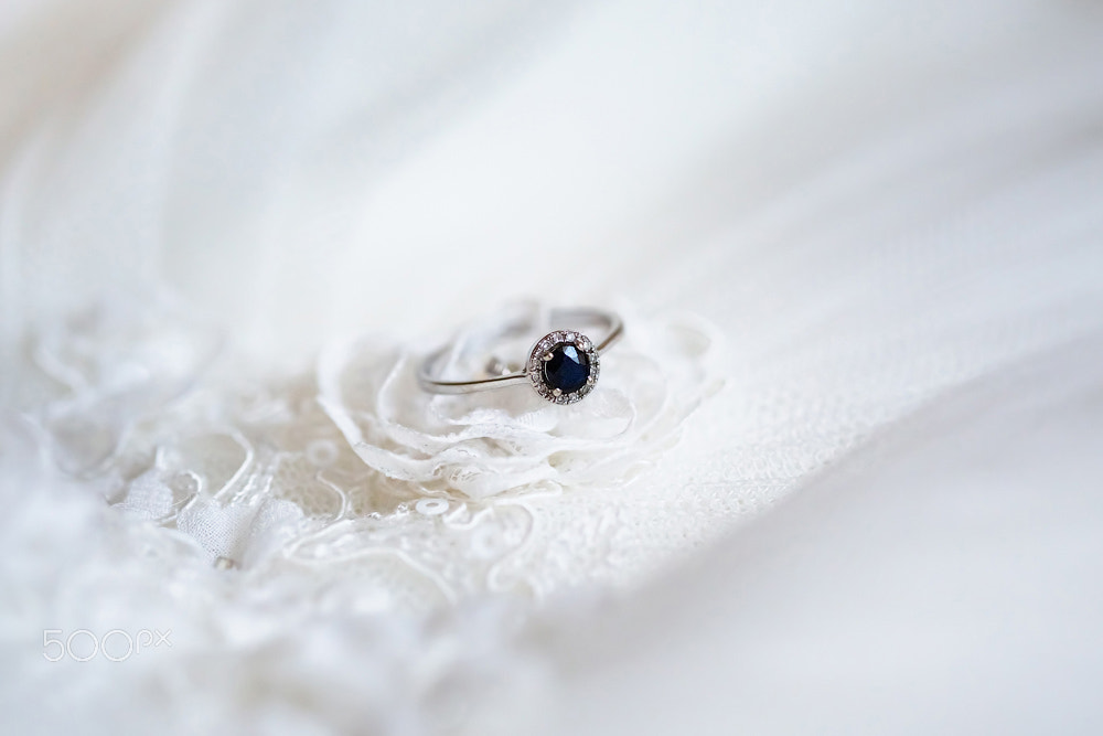 Engagement Ring with dark blue sapphire