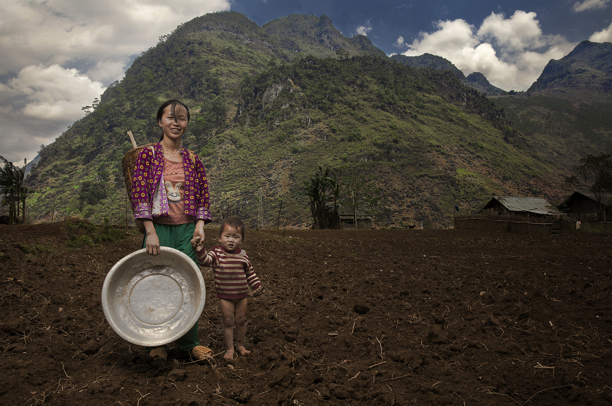 Sigma 24-35mm F2 DG HSM Art sample photo. A girl with her sister coming back to their home, after working on their farm. photography