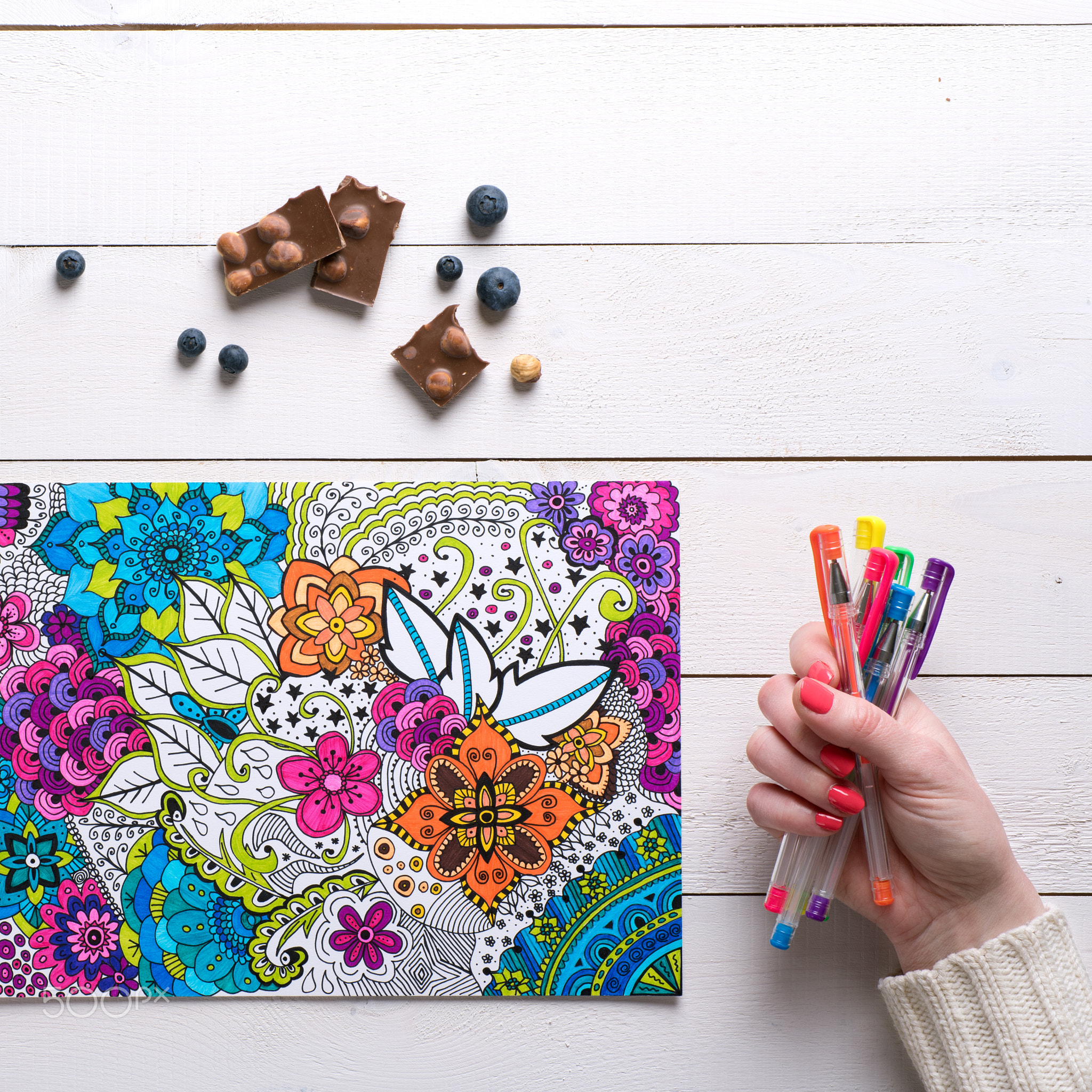 Flat lay, female coloring adult coloring books, new stress relieving trend