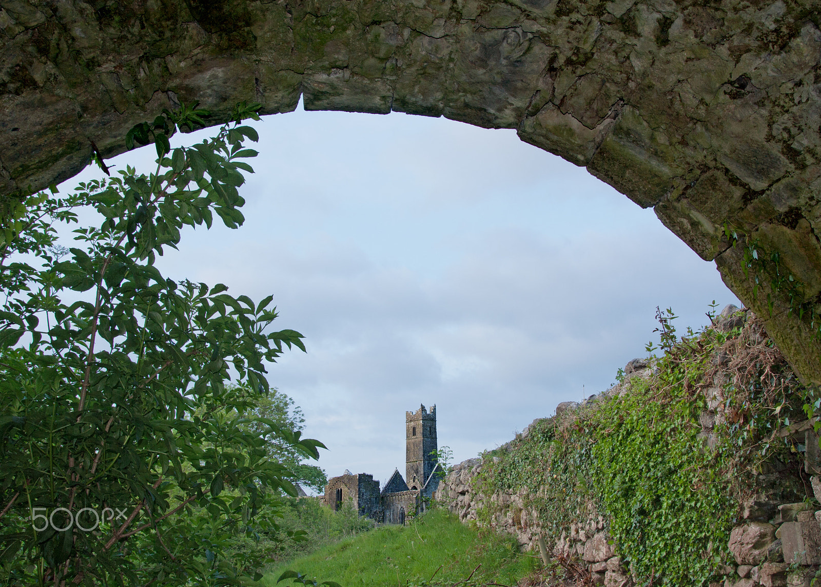 Canon EOS 1000D (EOS Digital Rebel XS / EOS Kiss F) sample photo. Quin abbey through the arch photography