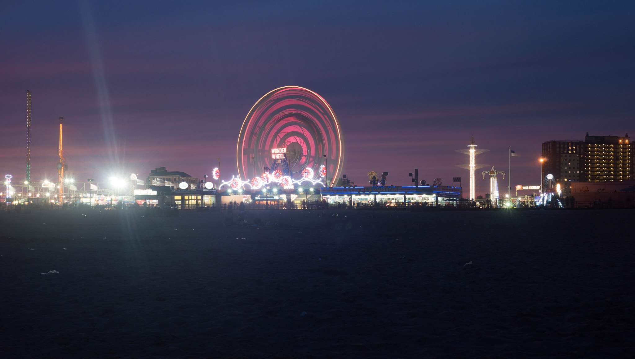 Nikon D3200 + Nikon AF Nikkor 28mm F2.8D sample photo. Photo was taken last night at coney island, brooklyn ny. light trails from the ferris wheel. photography
