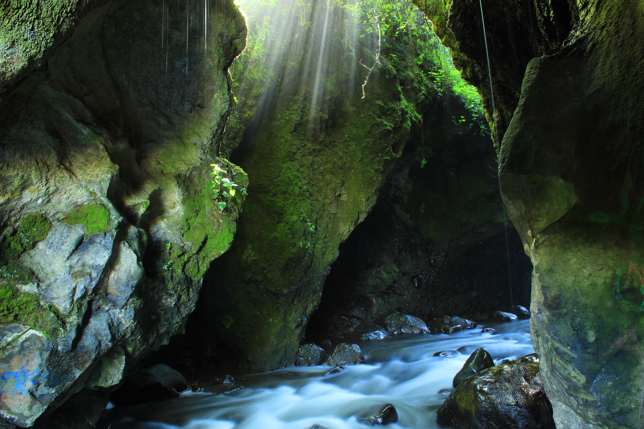 Canon EF-S 18-55mm F3.5-5.6 II sample photo. River flowing through a cave photography