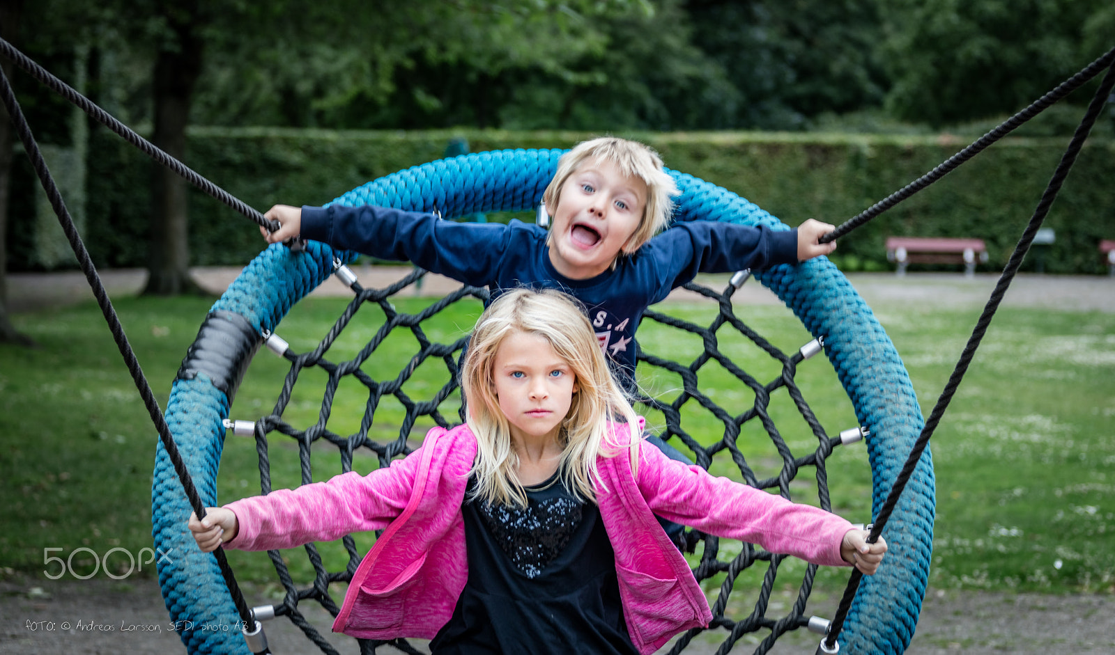 Canon EF 28-300mm F3.5-5.6L IS USM sample photo. Crazy brother and serious sister on swing photography