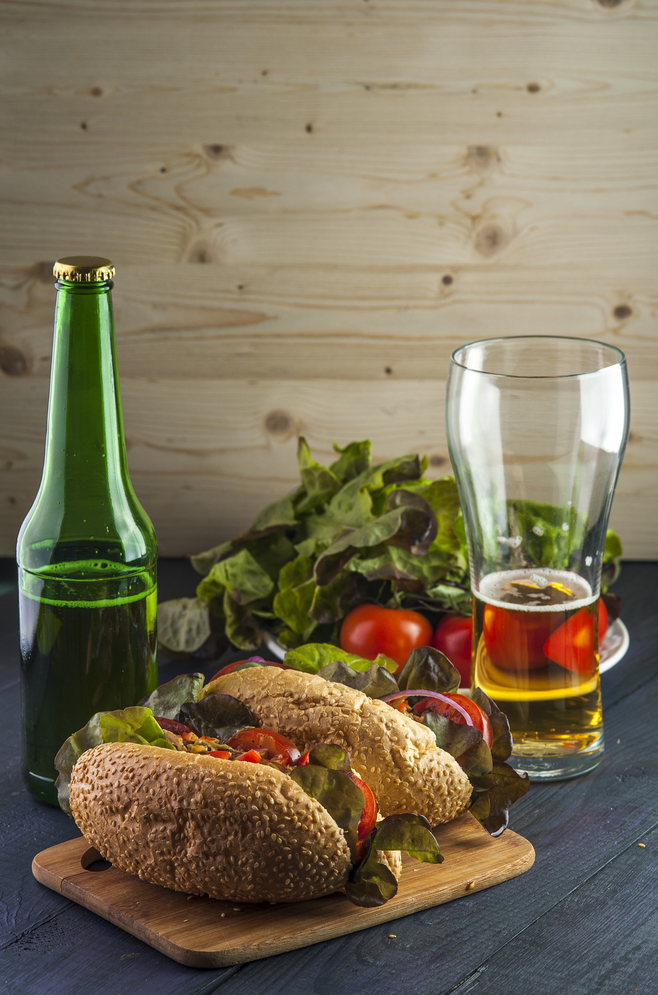Nikon D700 + AF Micro-Nikkor 105mm f/2.8 sample photo. Two delicious hotdogs, beer bottle and glass on wooden table. photography