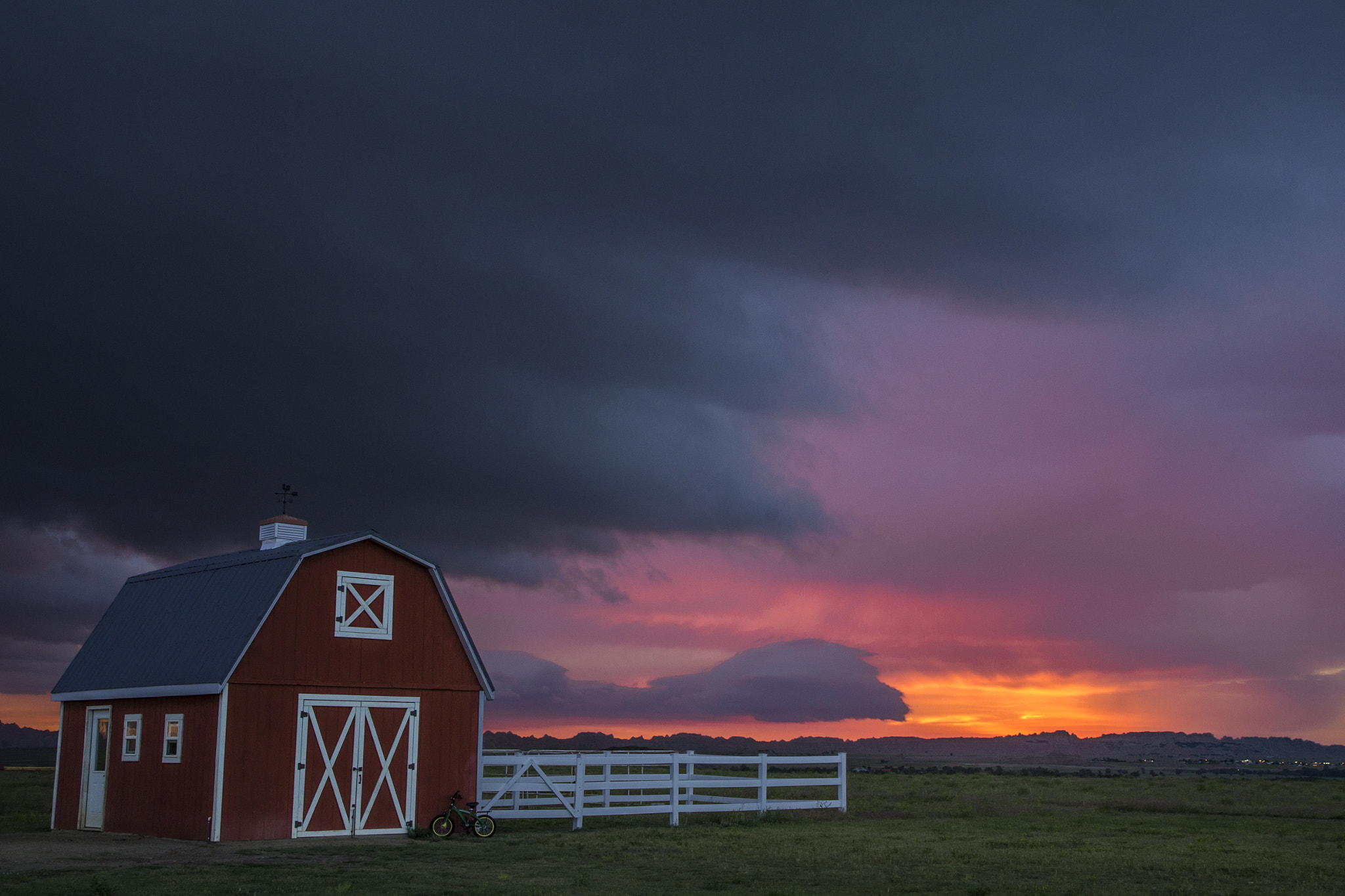 Pentax K-30 sample photo. Sunrise's last stand behind the barn photography