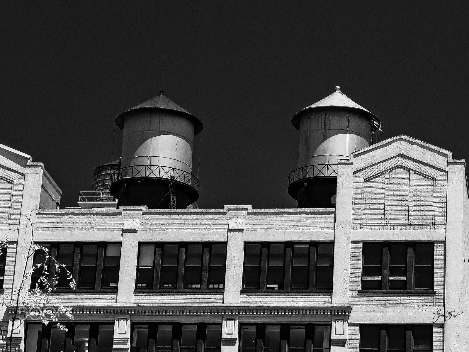 Olympus E-30 + Olympus Zuiko Digital ED 12-60mm F2.8-4.0 SWD sample photo. Two water towers photography