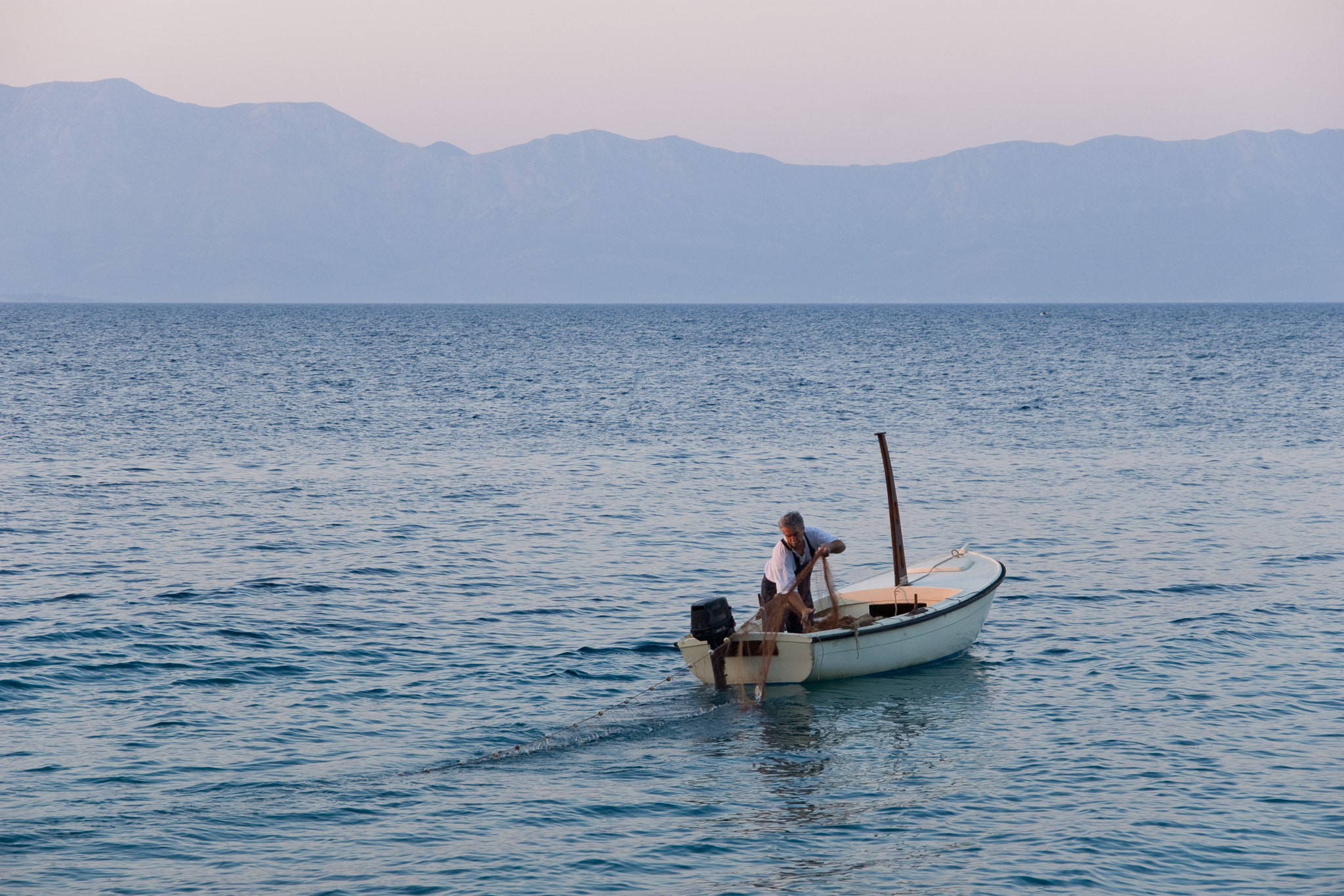 Pentax K100D sample photo. Fisherman at the dusk photography