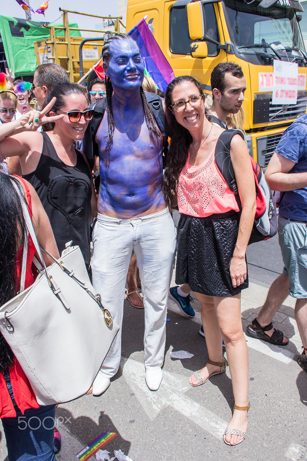 Canon EF 75-300mm F4.0-5.6 IS USM sample photo. Members of pride parade poses for the photographer photography