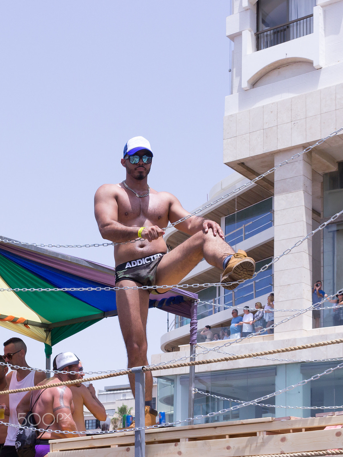 Canon EF 75-300mm F4.0-5.6 IS USM sample photo. Members of pride parade poses for the photographer photography