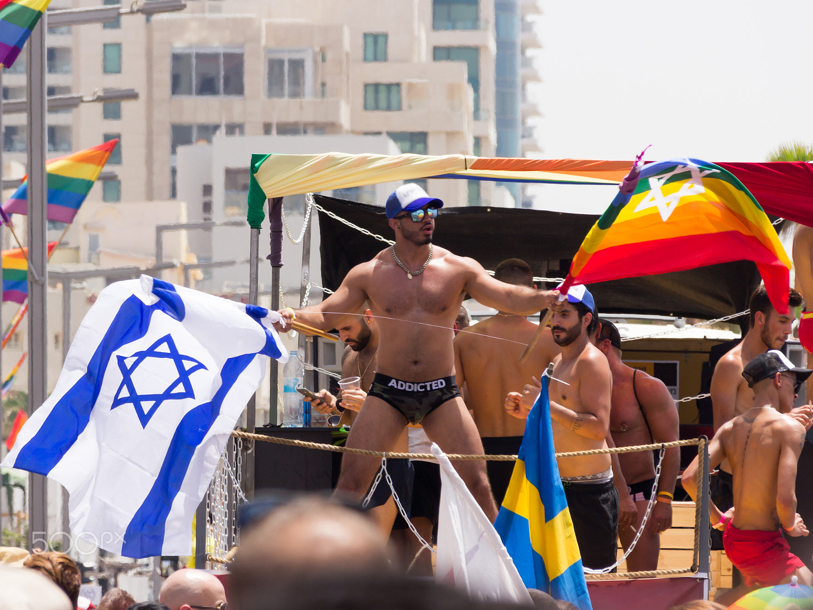 Canon EF 75-300mm F4.0-5.6 IS USM sample photo. Members of pride parade poses for the photographer photography