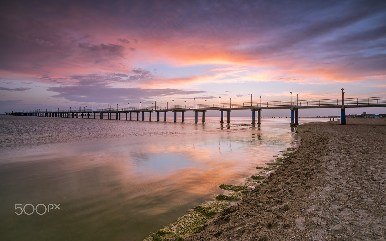 Sony a7R + Canon EF 17-40mm F4L USM sample photo. Sunset on the beach after a storm, the pier and the in the evening photography