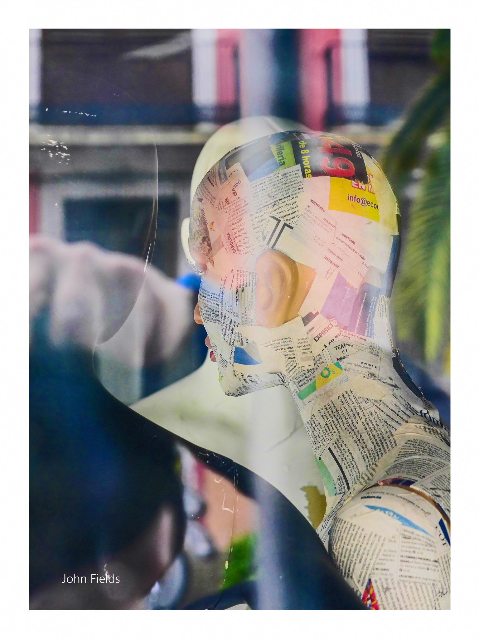 Panasonic Lumix G X Vario 35-100mm F2.8 OIS sample photo. Mannequin wrapped in newspaper. photography