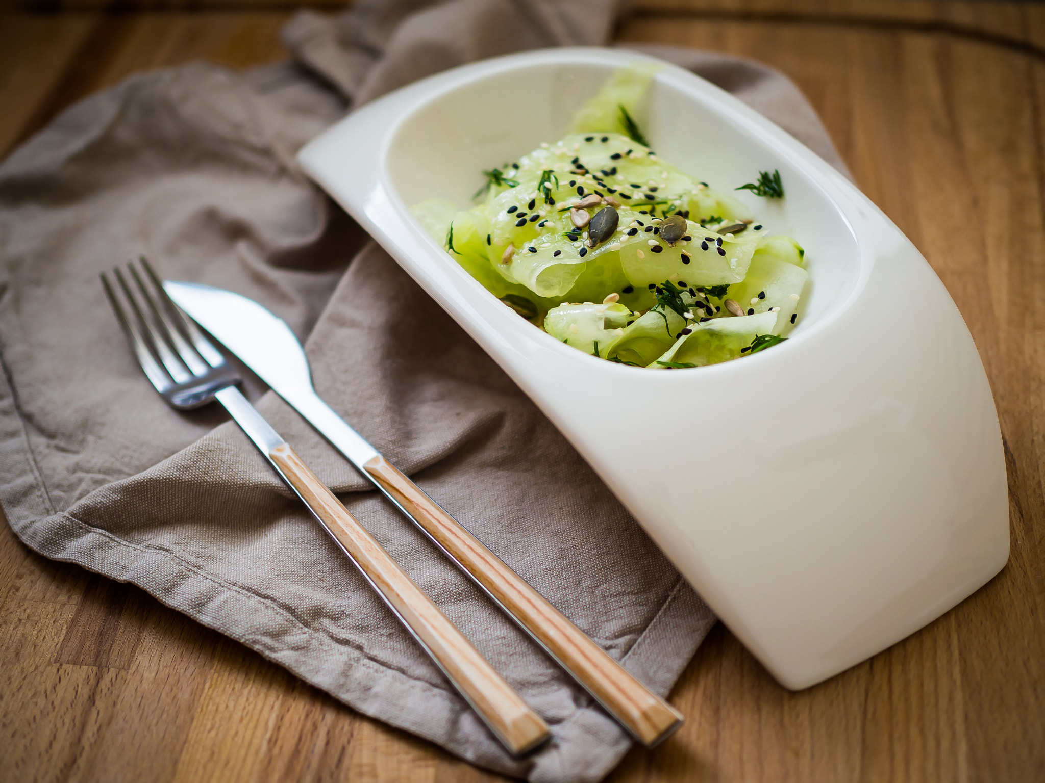 Olympus M.Zuiko Digital 25mm F1.8 sample photo. Cucumber salad, olive oil and pumpkin seeds photography