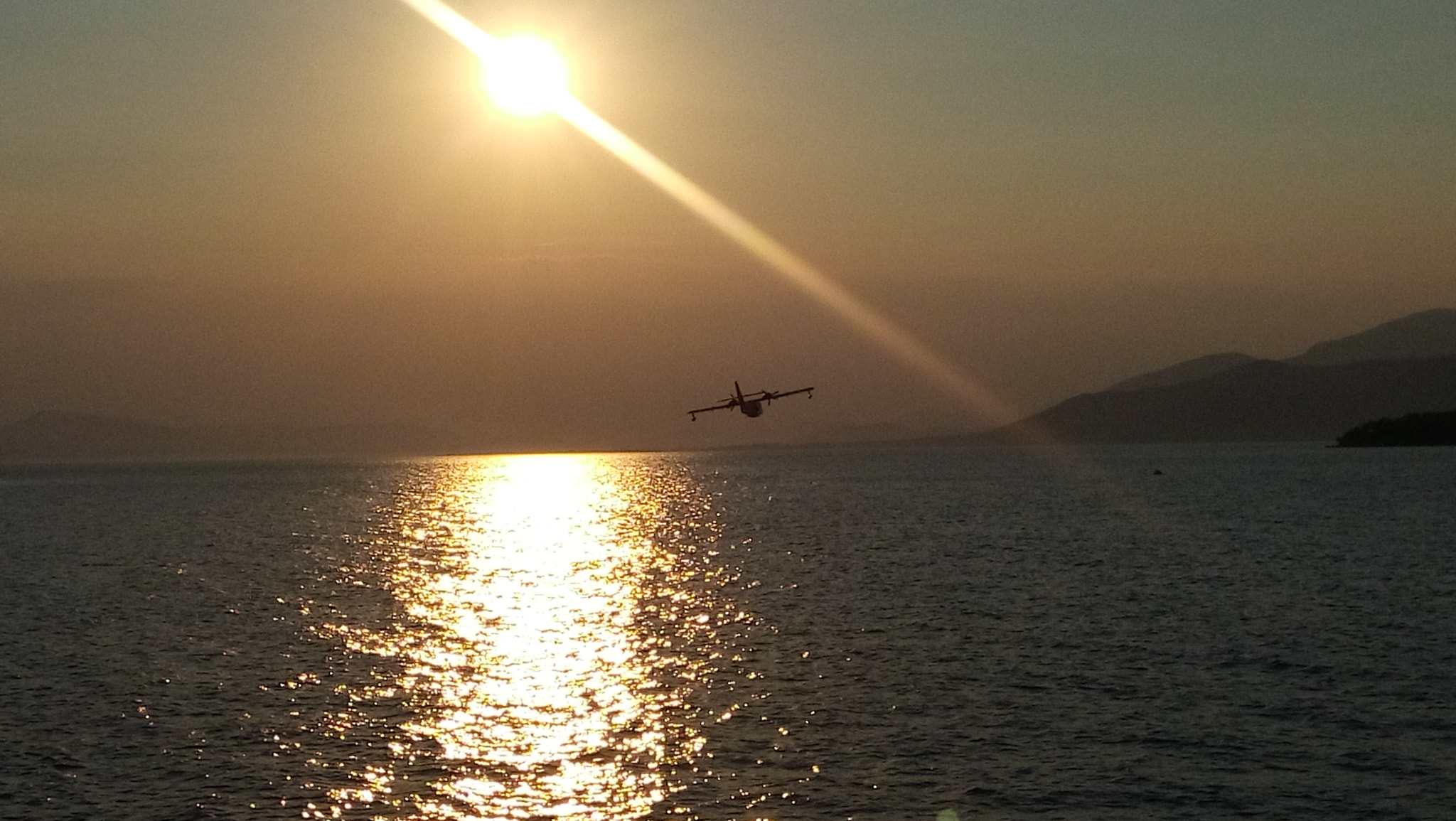 LG LBello sample photo. Canadair:flying into the sunset photography