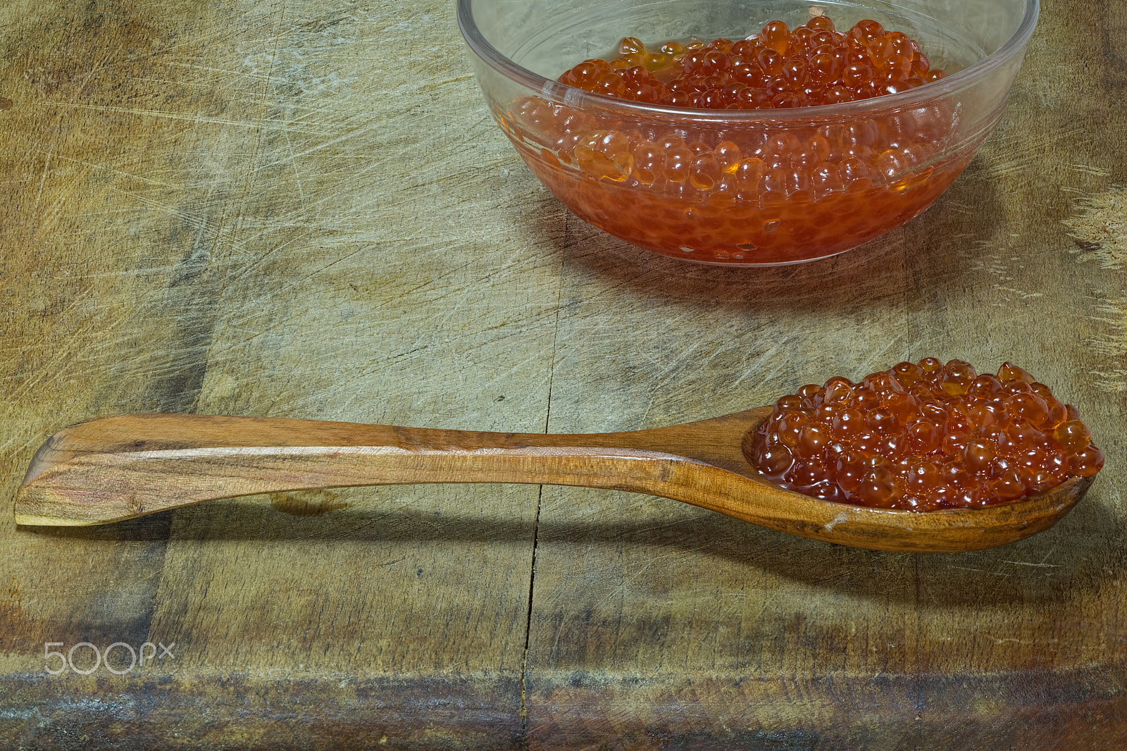 Canon EOS 650D (EOS Rebel T4i / EOS Kiss X6i) + Canon EF 100mm F2.8 Macro USM sample photo. Wooden spoon with red caviar on a wooden background photography