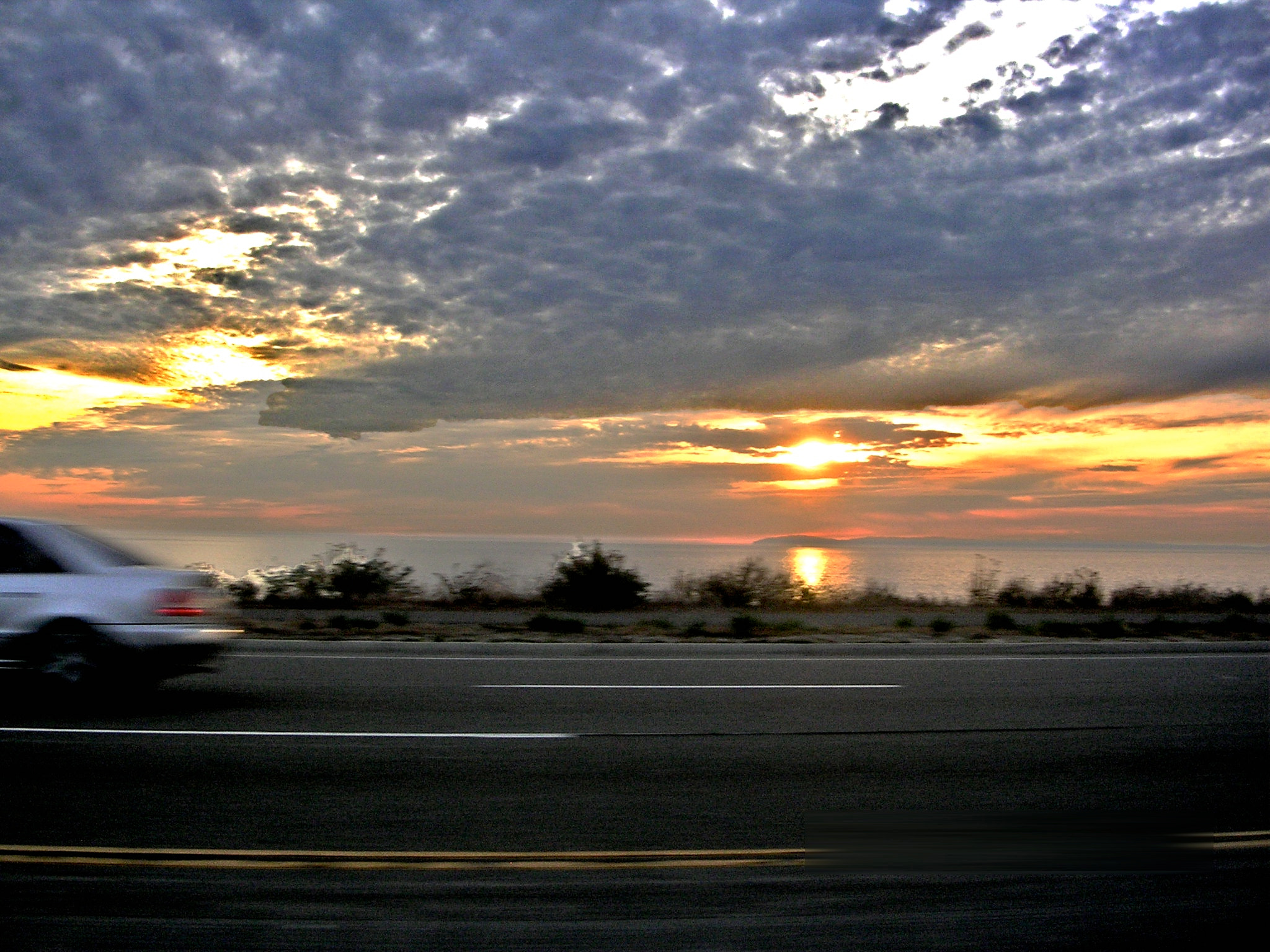 Nikon E3200 sample photo. Cars on the road, eyes on the sun by remzi oten photography