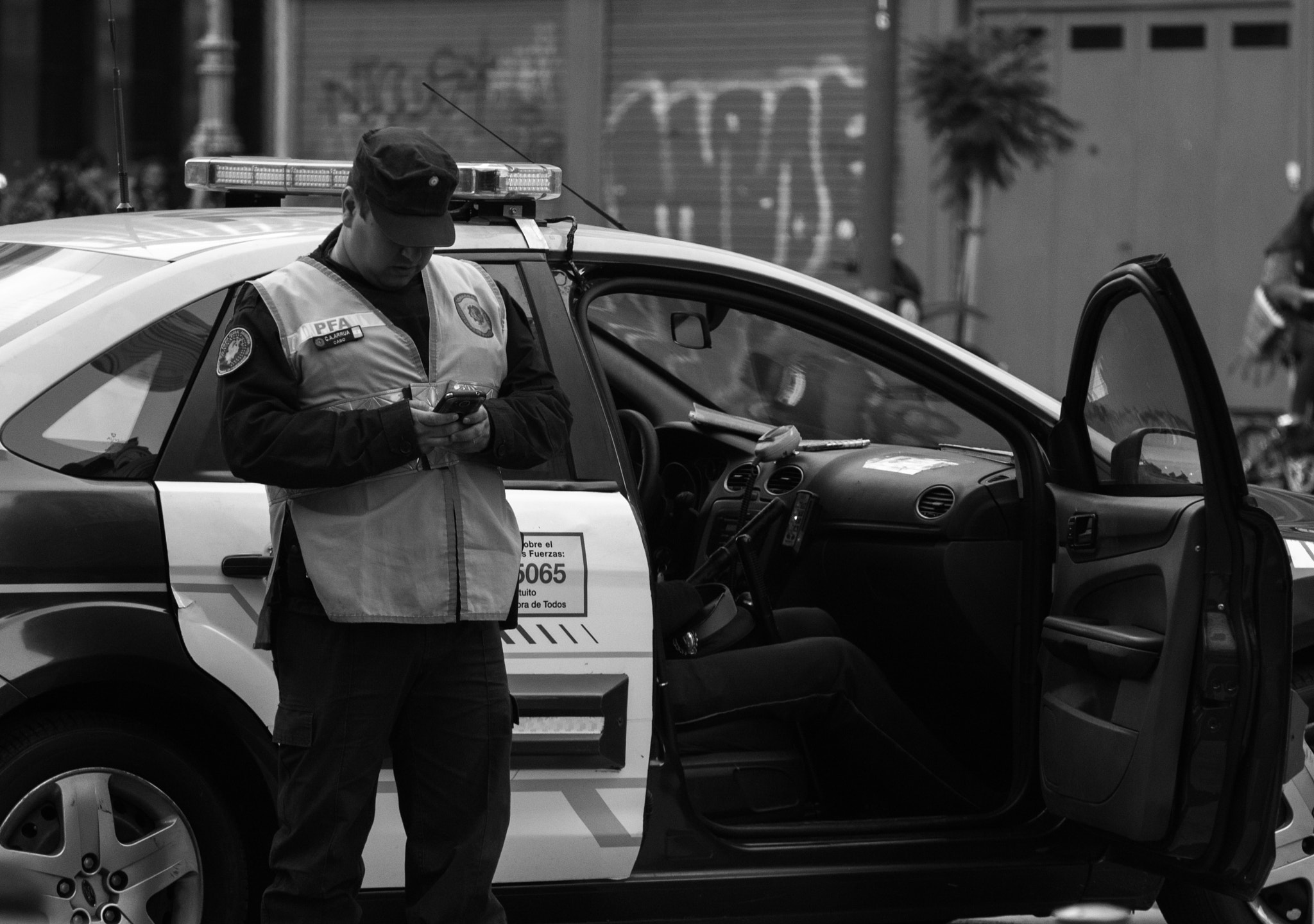 Nikon D3100 sample photo. Cop texting -2016 photography