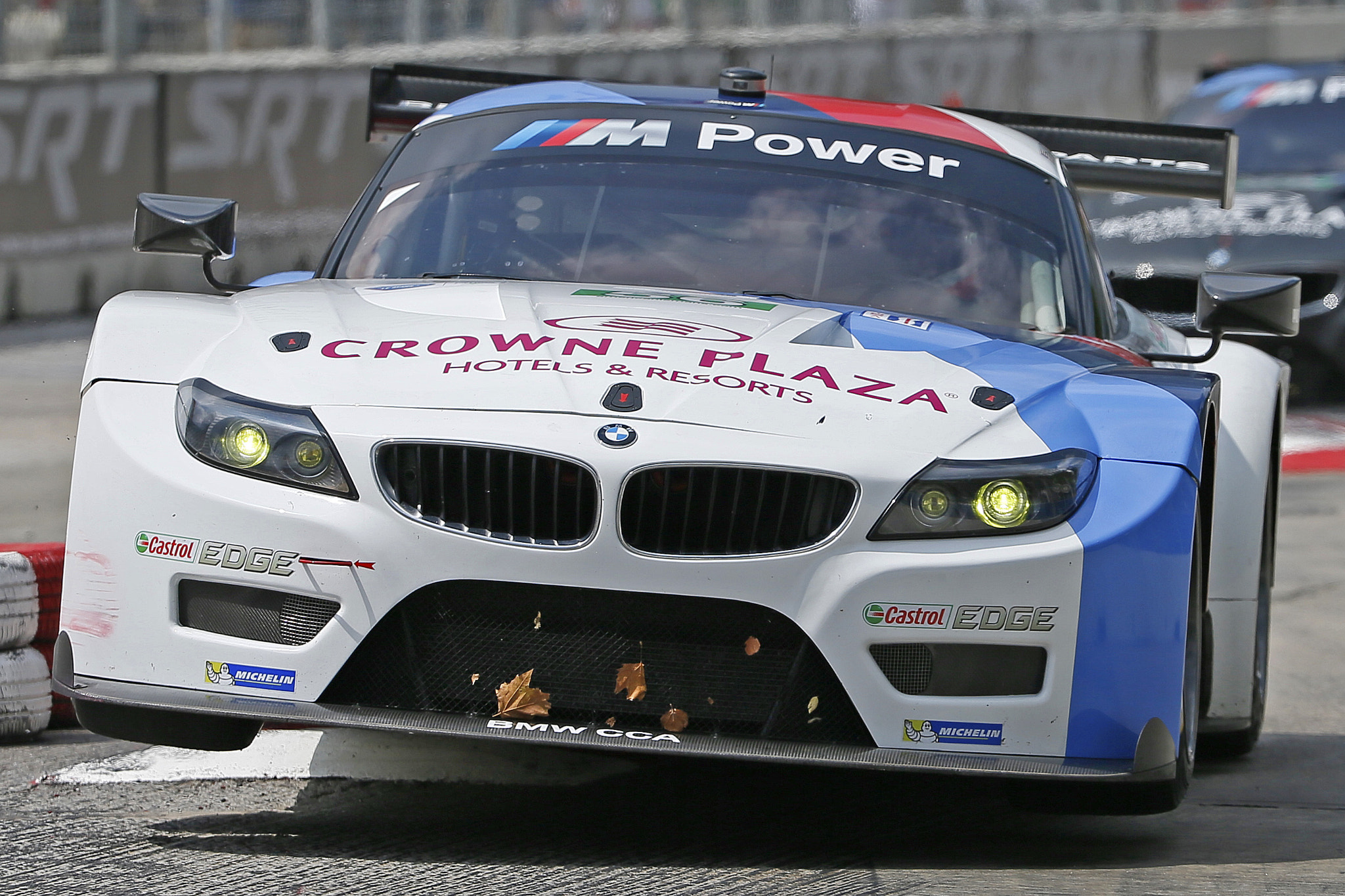 Canon EF 200-400mm F4L IS USM Extender 1.4x sample photo. A bmw le mans racer gets airborne crossing the chicane during the baltimore grand prix. photography