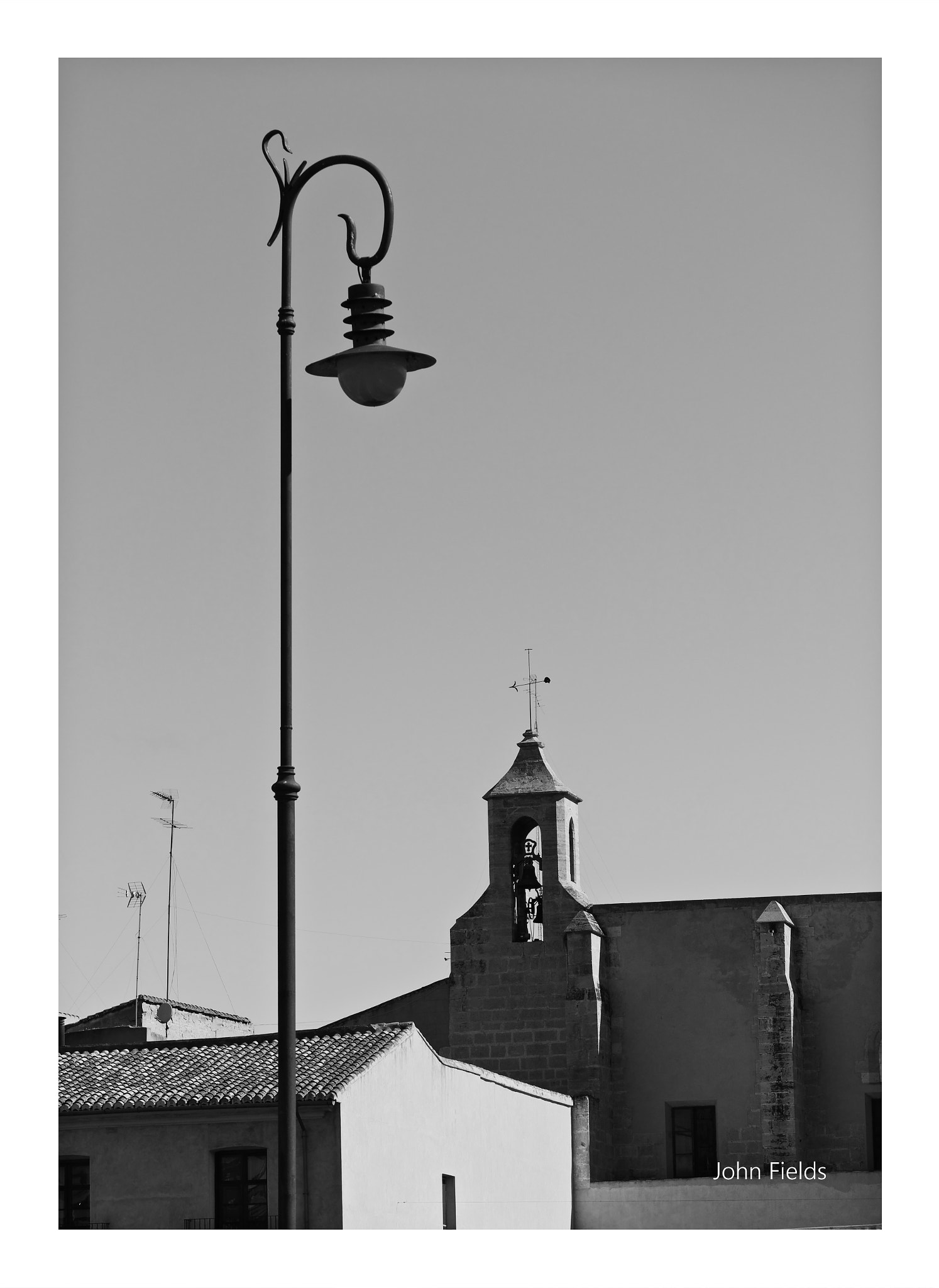 Panasonic Lumix G X Vario 35-100mm F2.8 OIS sample photo. Lamp post & buildings photography