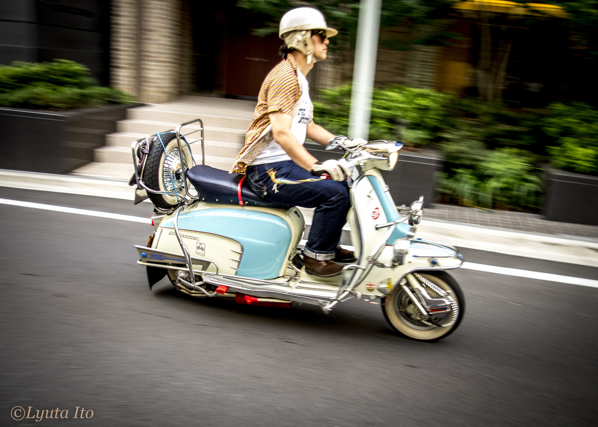 Pentax smc DA 18-55mm F3.5-5.6 AL sample photo. A man on a scooter photography
