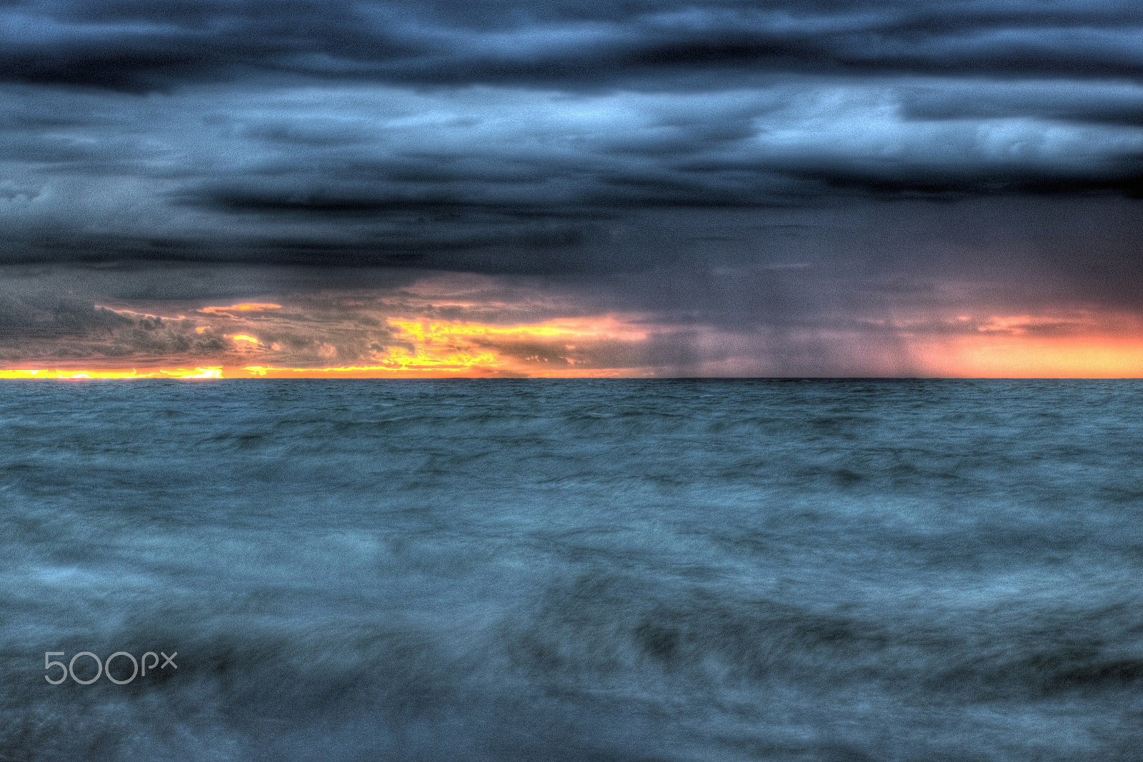 Canon EF-S 17-85mm F4-5.6 IS USM sample photo. Distant storm sunset photography