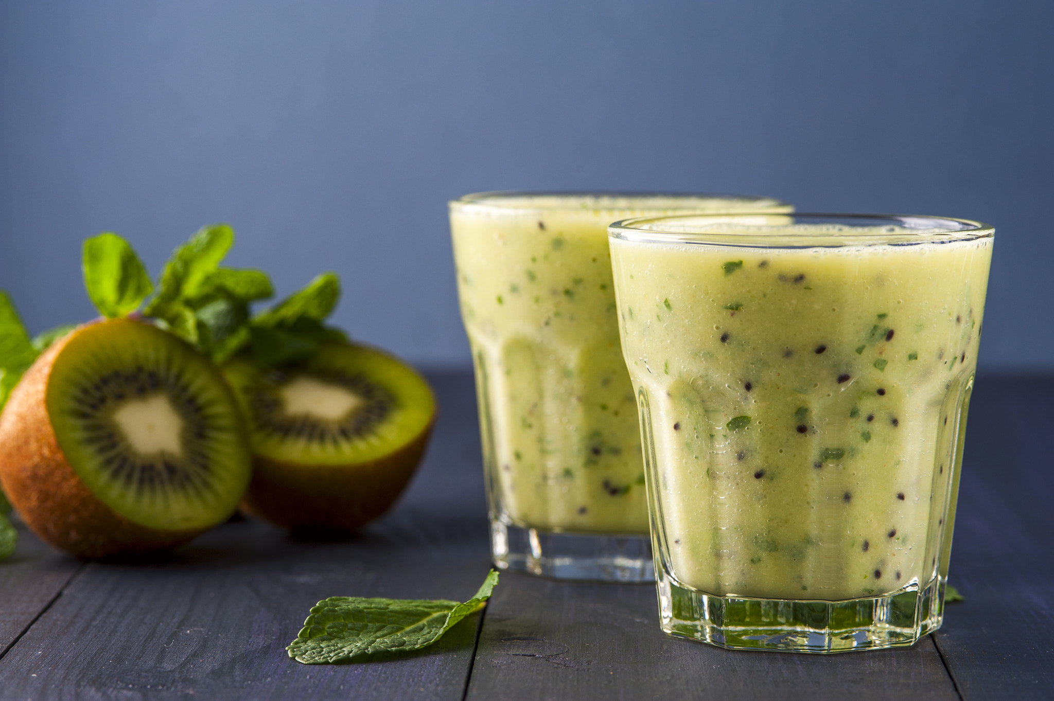 Nikon D700 + AF Micro-Nikkor 105mm f/2.8 sample photo. Two glasses of homemade smoothie with kiwi, banana and mint leaves . conception of healthy food. ... photography