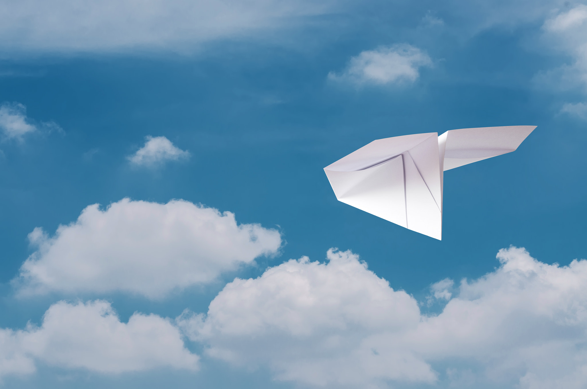 Sigma 50-150mm F2.8 EX APO DC HSM II sample photo. Paper plane flying over clouds with blue sky. photography