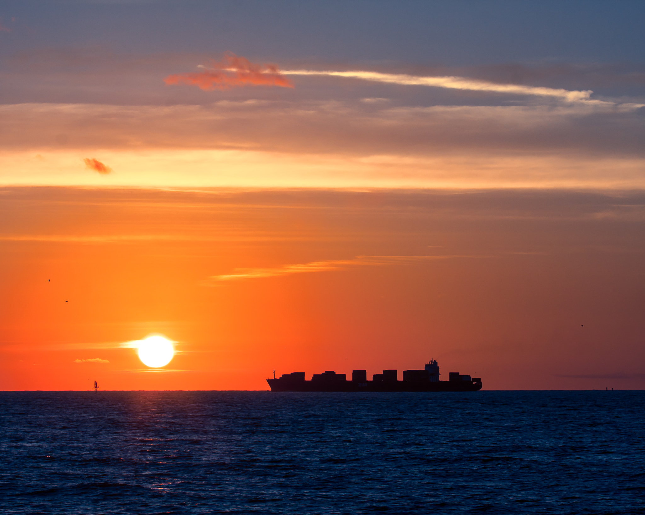Canon EF 100-400mm F4.5-5.6L IS USM sample photo. Tybee island sunrise cargo ship silhouette photography