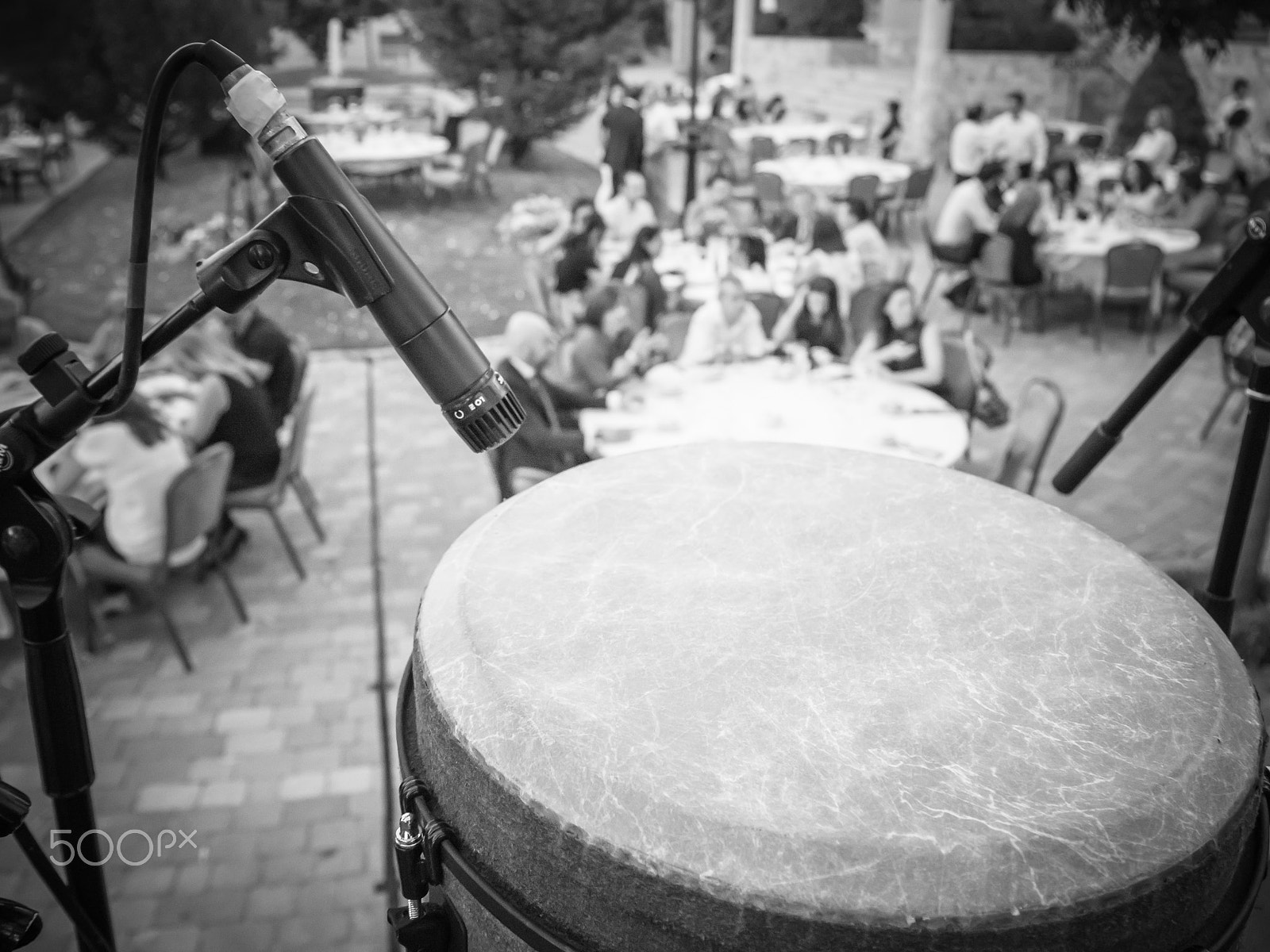 Panasonic Lumix DMC-GH3 + Panasonic Lumix G Vario 14-140mm F3.5-5.6 ASPH Power O.I.S sample photo. Diners from percussio on the stage black and white photography