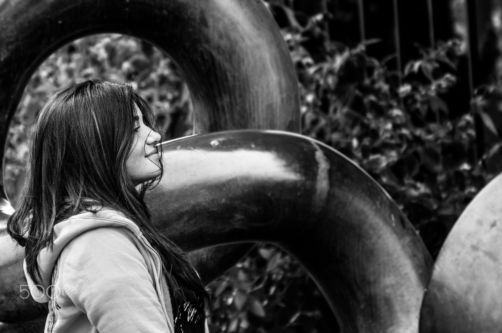Sony Alpha NEX-5N + Sony E 55-210mm F4.5-6.3 OSS sample photo. B & w smiles photography