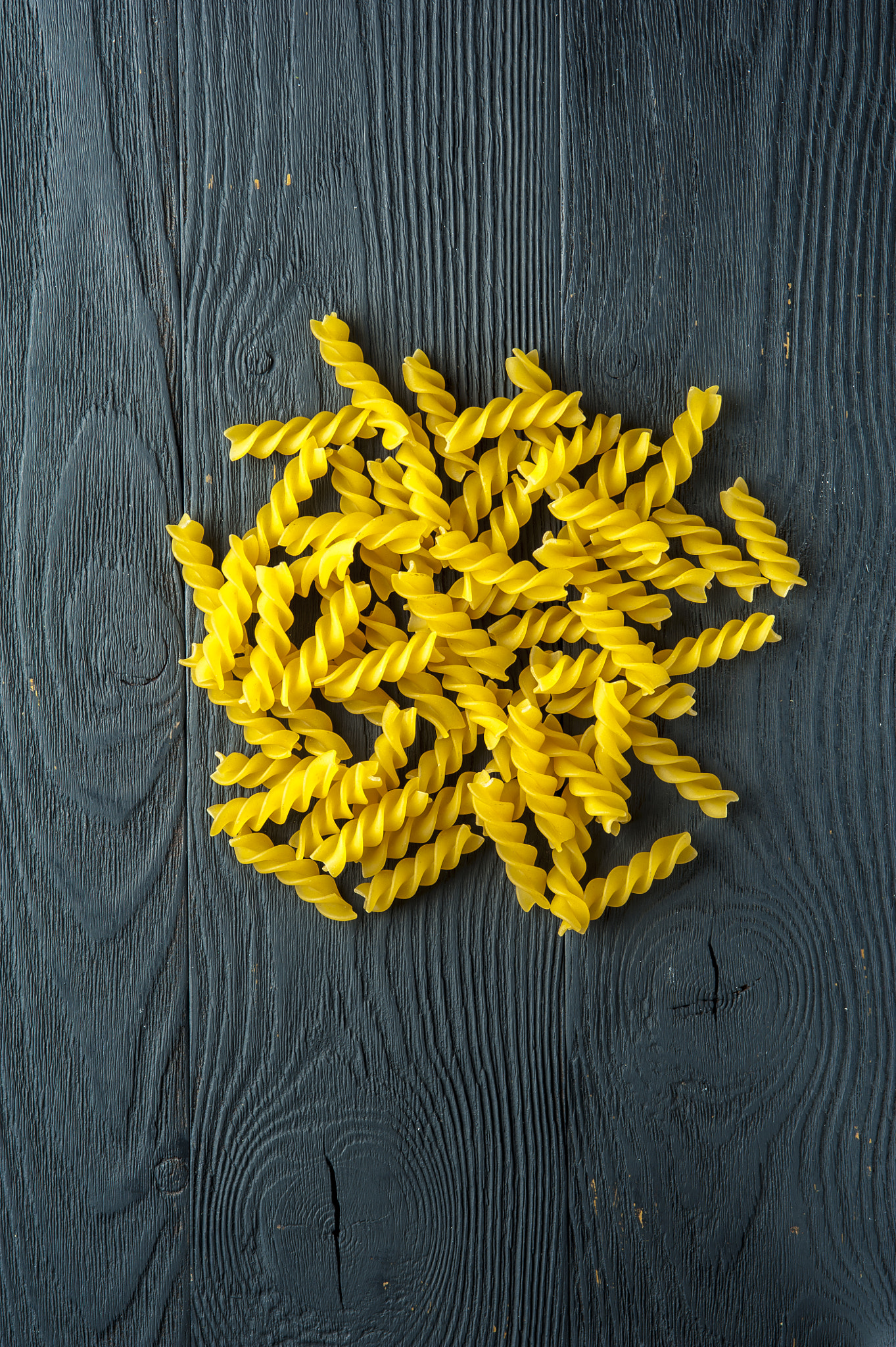 Nikon D700 + AF Micro-Nikkor 105mm f/2.8 sample photo. Fusilli pasta on a old wooden background. italian cuisine. photography